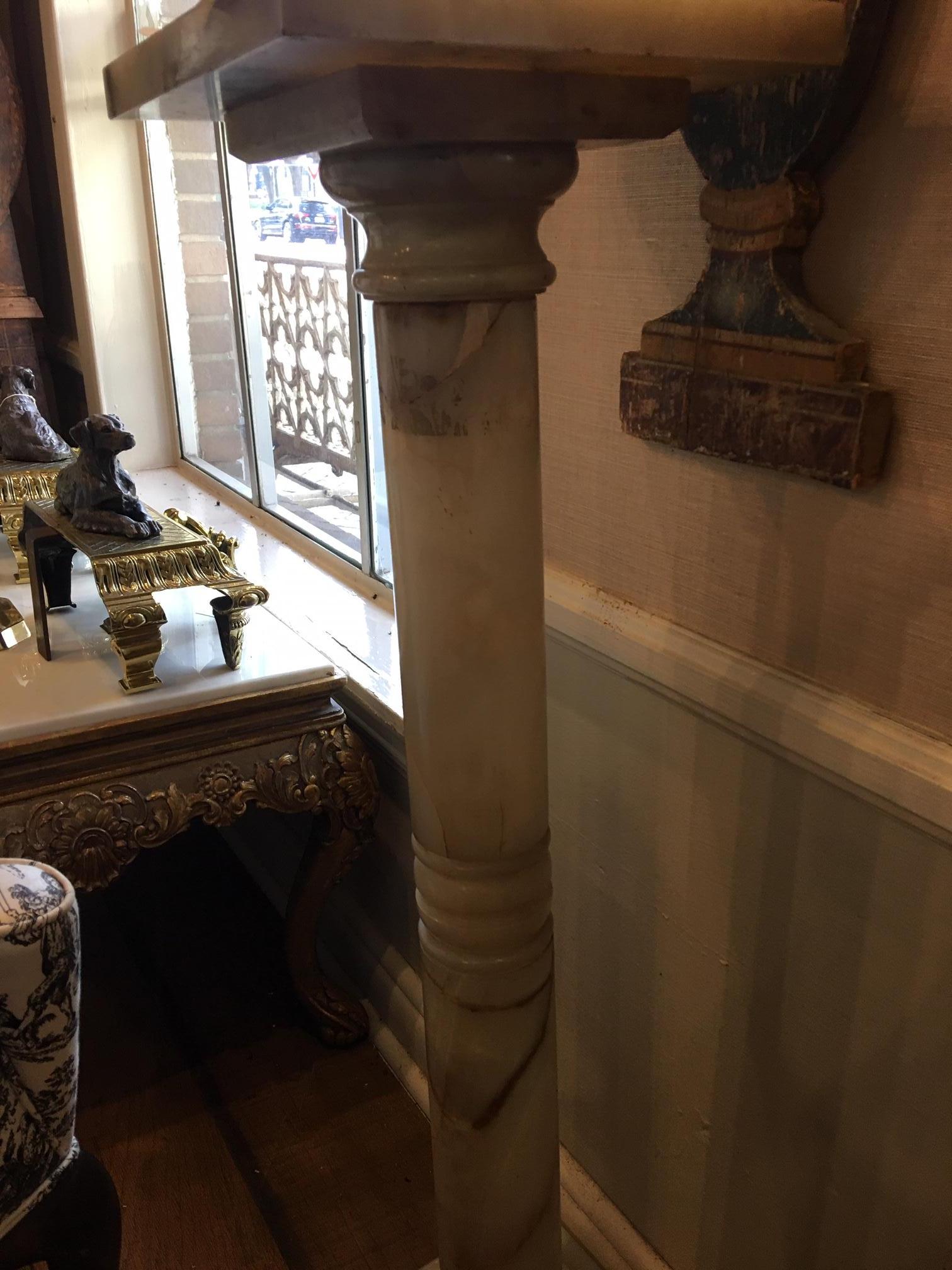 French onyx pedestal, late 19th century. Having a square top and base joined by turned standard.
         