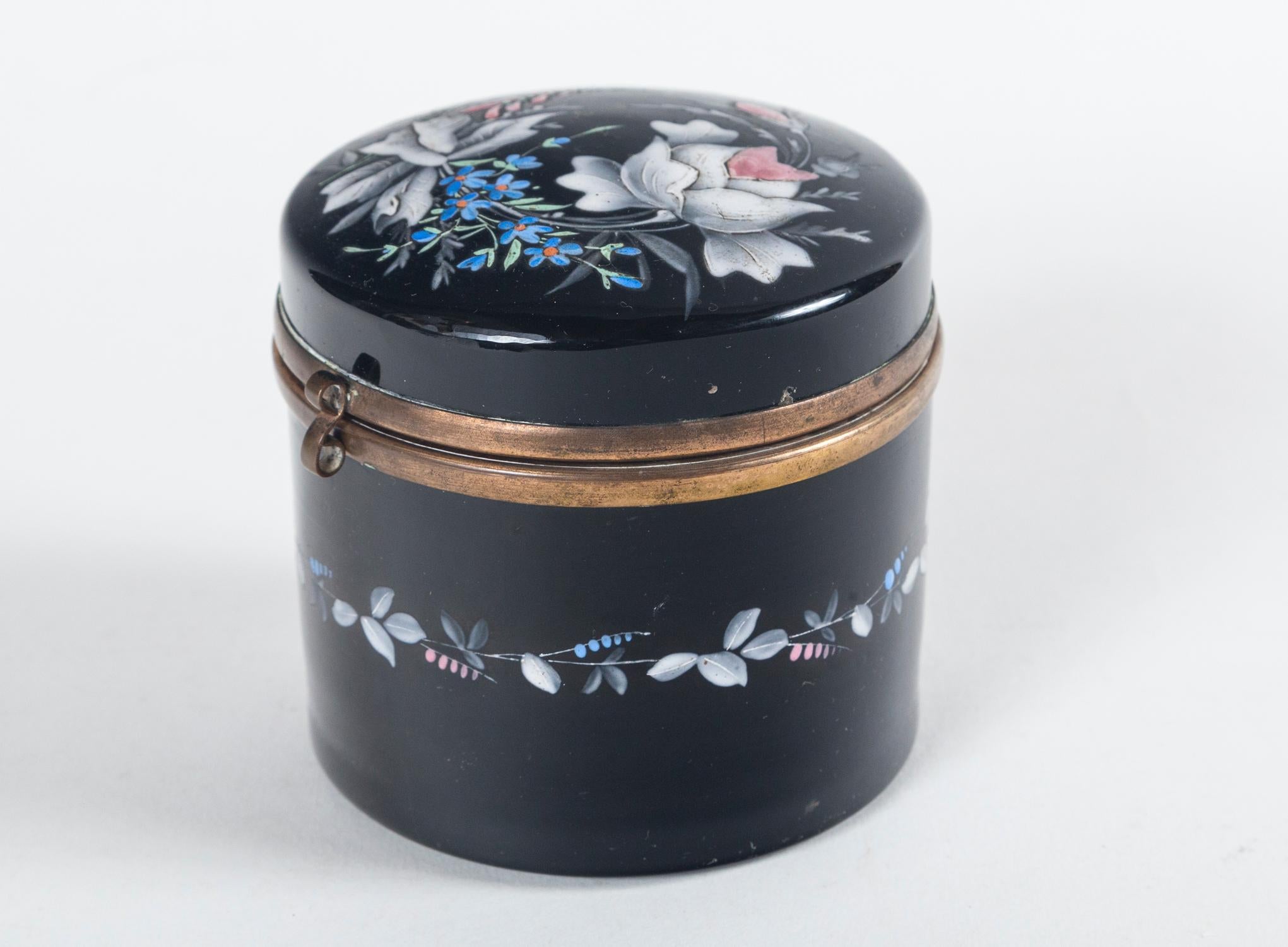 French Opaline enamelled glass vanity box, late 19th century. Delicate floral design on black glass with bronze trim.