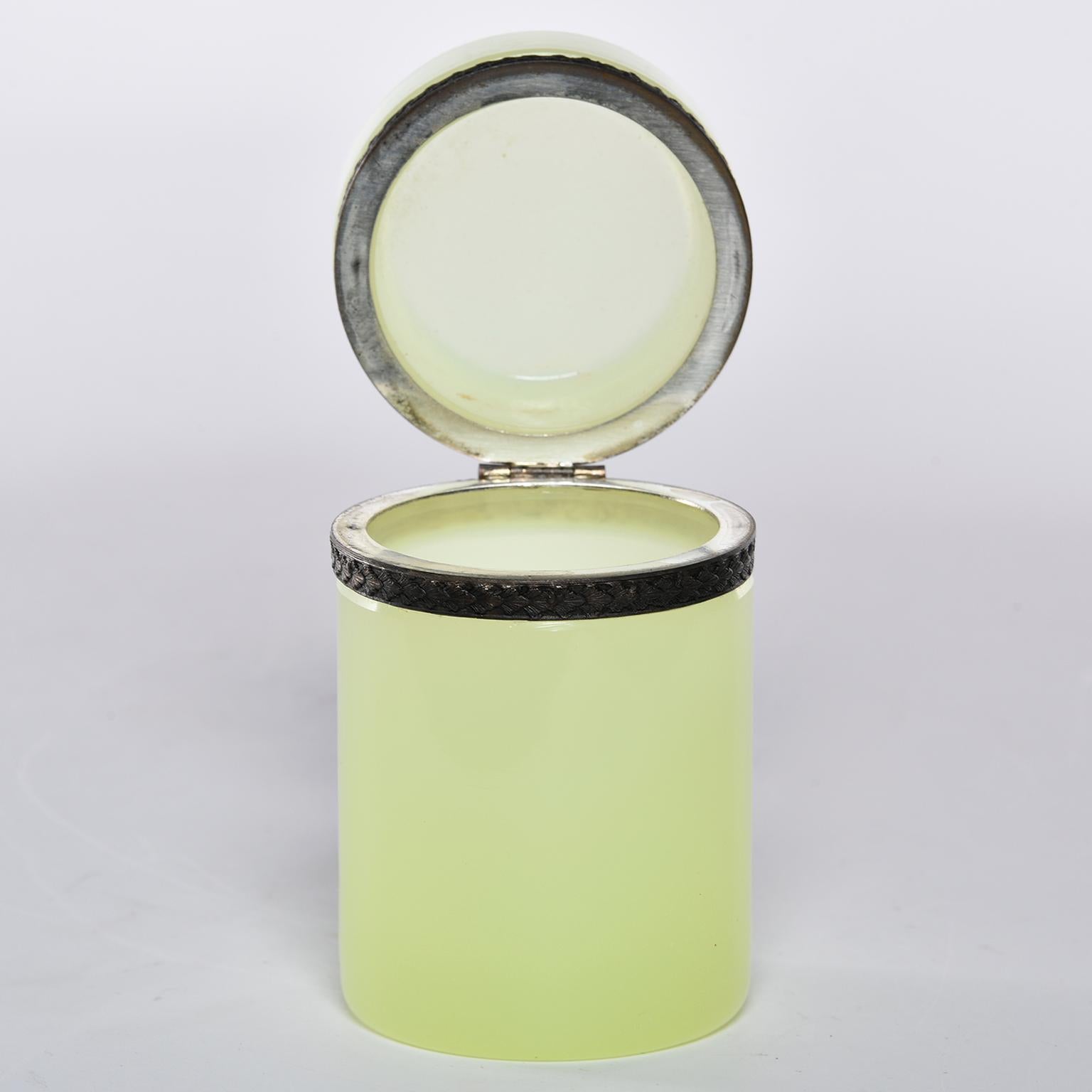 French uranium opaline glass cylindrical hinged box has brass trim. Unknown maker, circa 1920s.