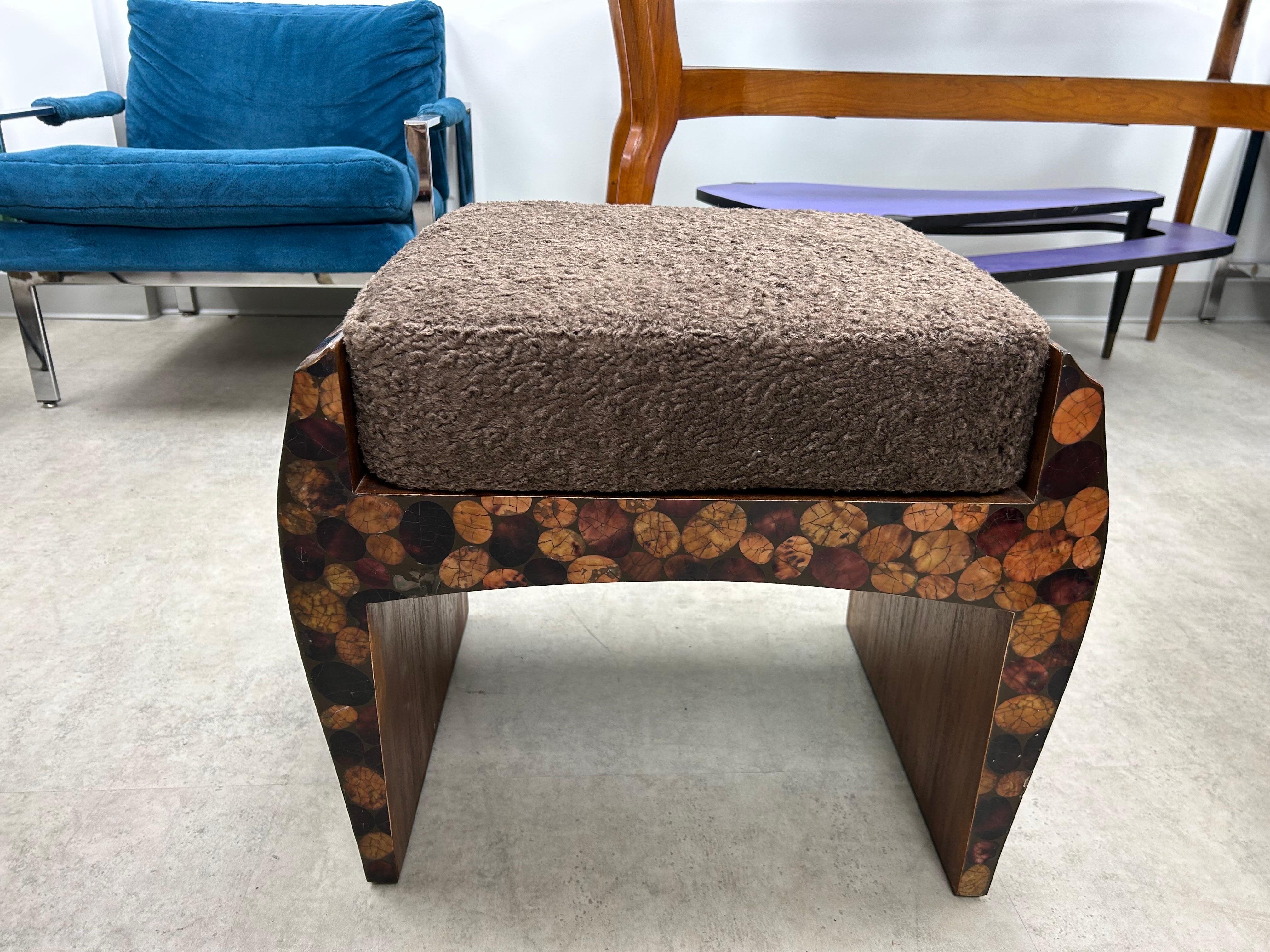 French Organic Modern Bench By R & Y Augousti.
This handsome French lacquered wood bench has the appearance of tortoise shell.
Perfect for extra seating where needed. Newly upholstered in a high end neutral lambs wood type fabric. Appropriate makers