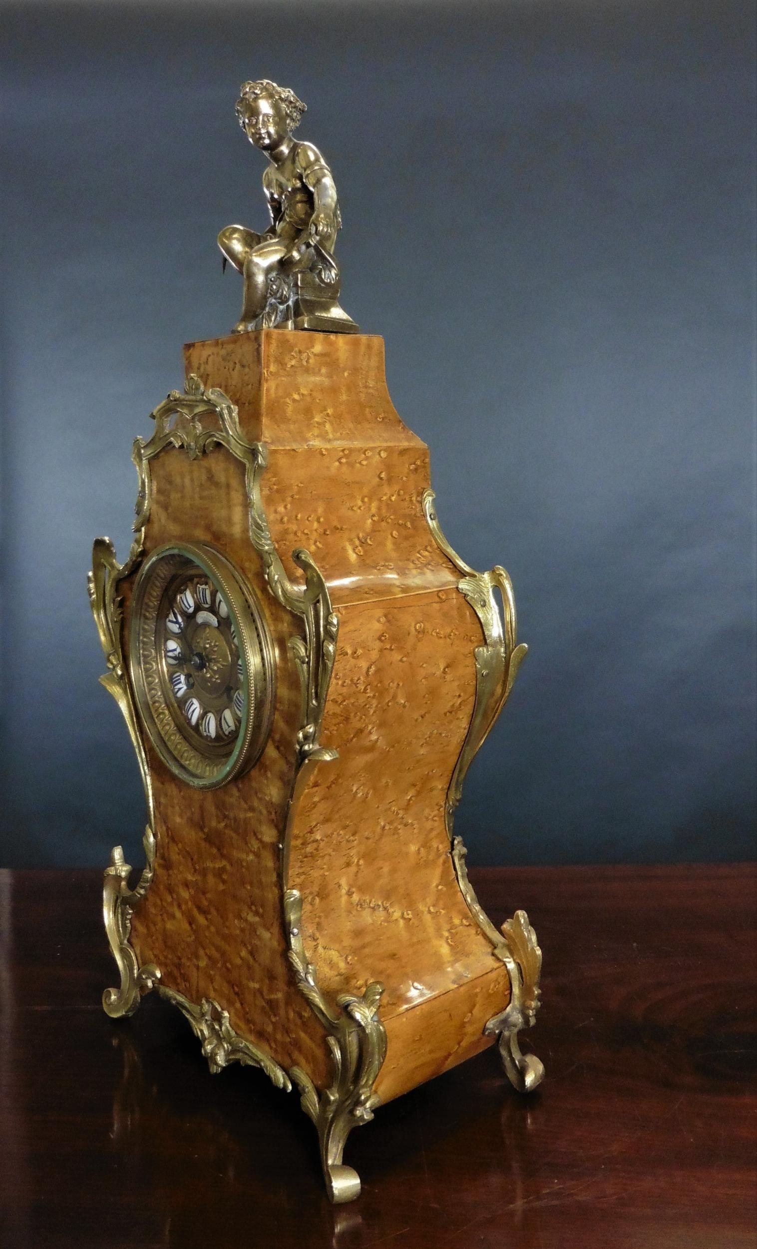 Outstanding Boulle clock in ‘Birds Eye’ maple with fine ormolu mounts standing on four outswept feet

Gilded dial signed Comptoir General, Paris with individual enamel Roman numerals and original ‘blued’ steel hands.

Eight day French movement