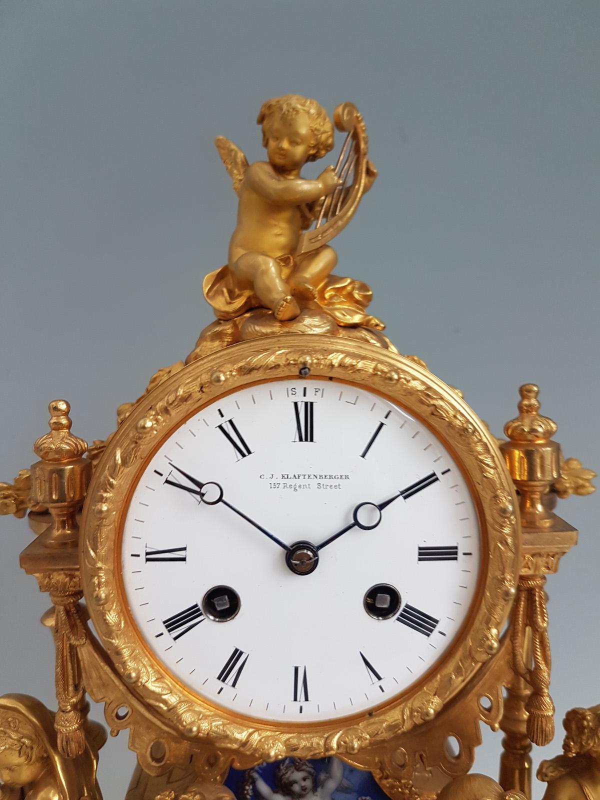 French ormolu and blue porcelain mantel clock. The blue porcelain with blue ground and decorated with baskets of flowers, fruit and doves, cherubs. A clock of the very highest quality, a beautiful example of the best of mid-19th century