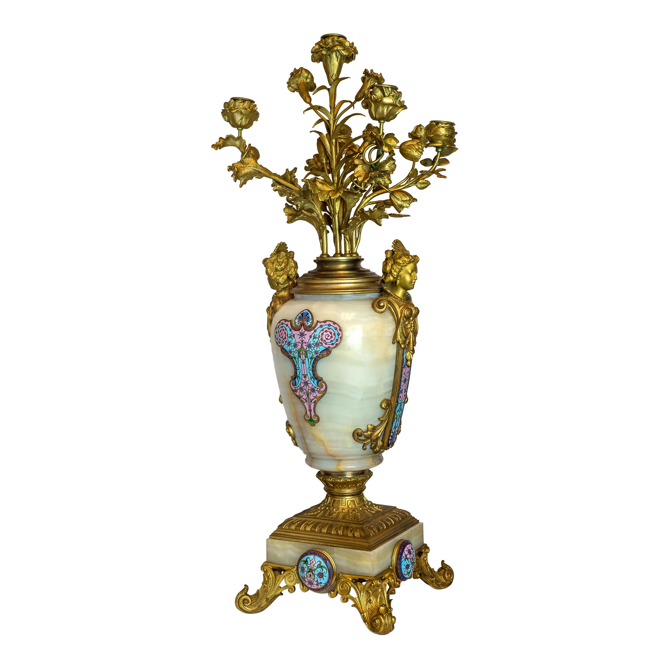 Exquisite pair of ormolu-mounted 5-light onyx vase candelabras and a pair of French ormolu and champlevé enamel-mounted Onyx pedestals, each of column form with ionic capital and square plinth.

Date: 19th century
Origin: French
Dimension: