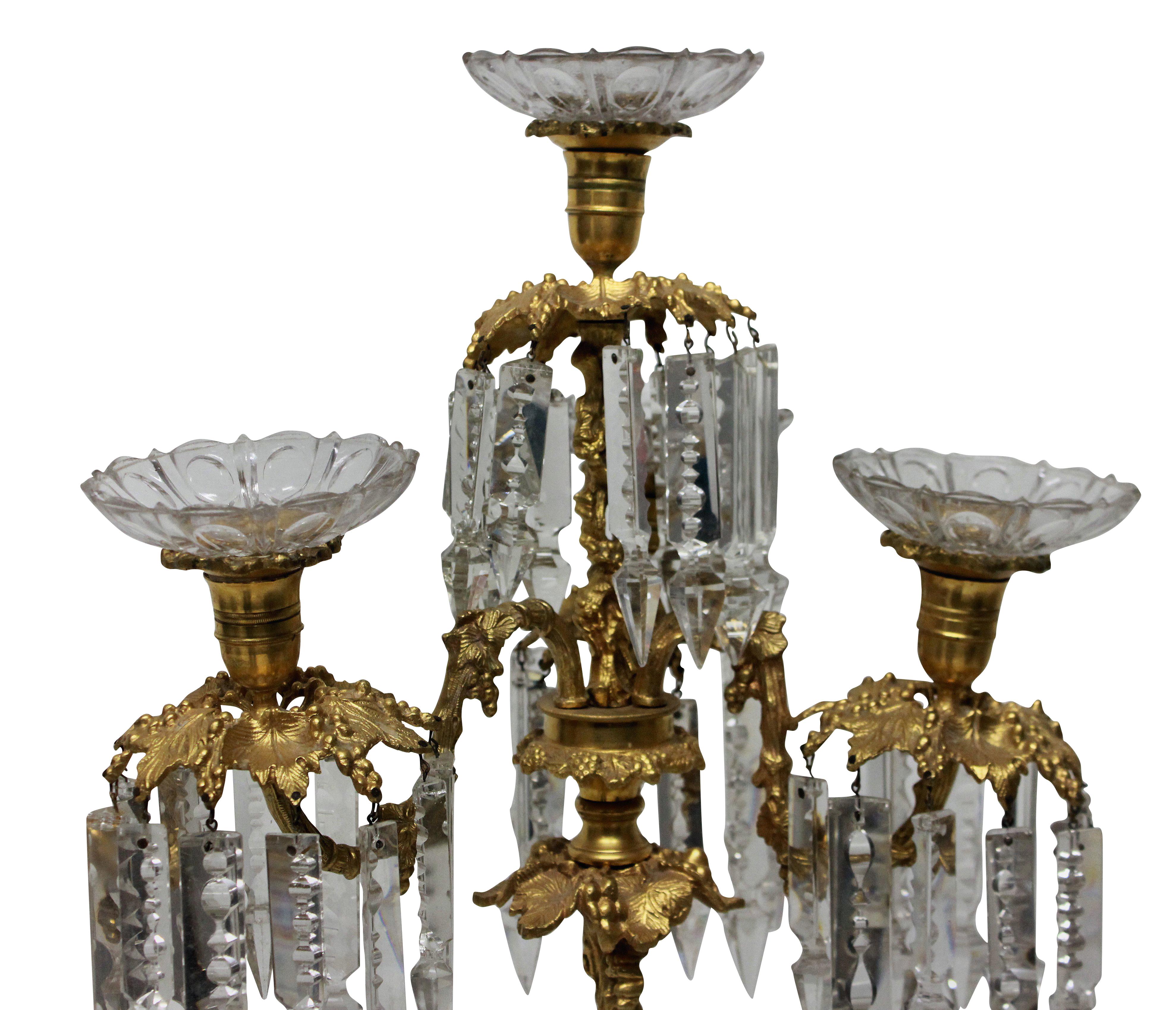 A French ormolu and glass candelabrum, the ormolu depicting vines.

 