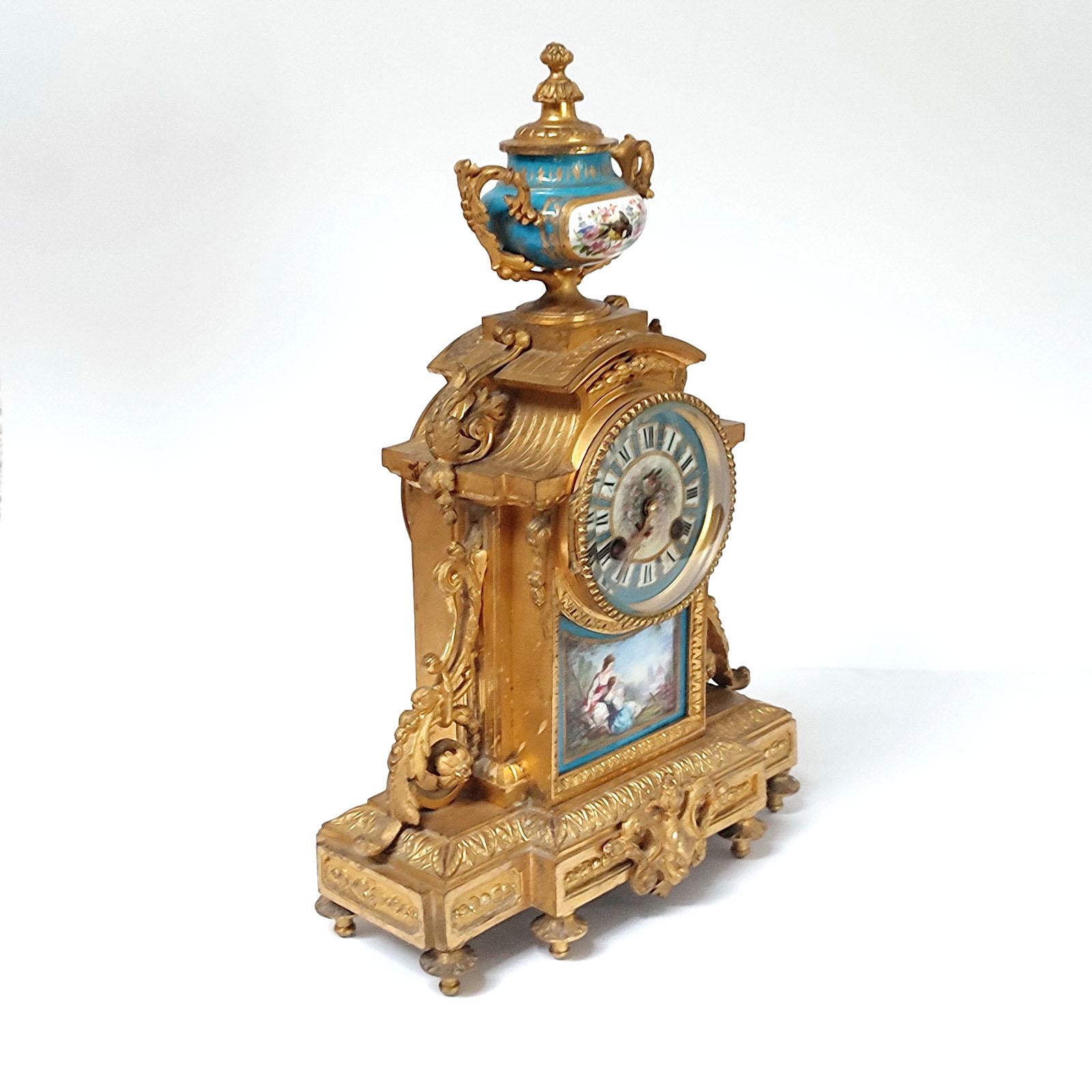 French Ormolu and Porcelain Mantle Clock and Pair of Candelabra, 19th Century 1