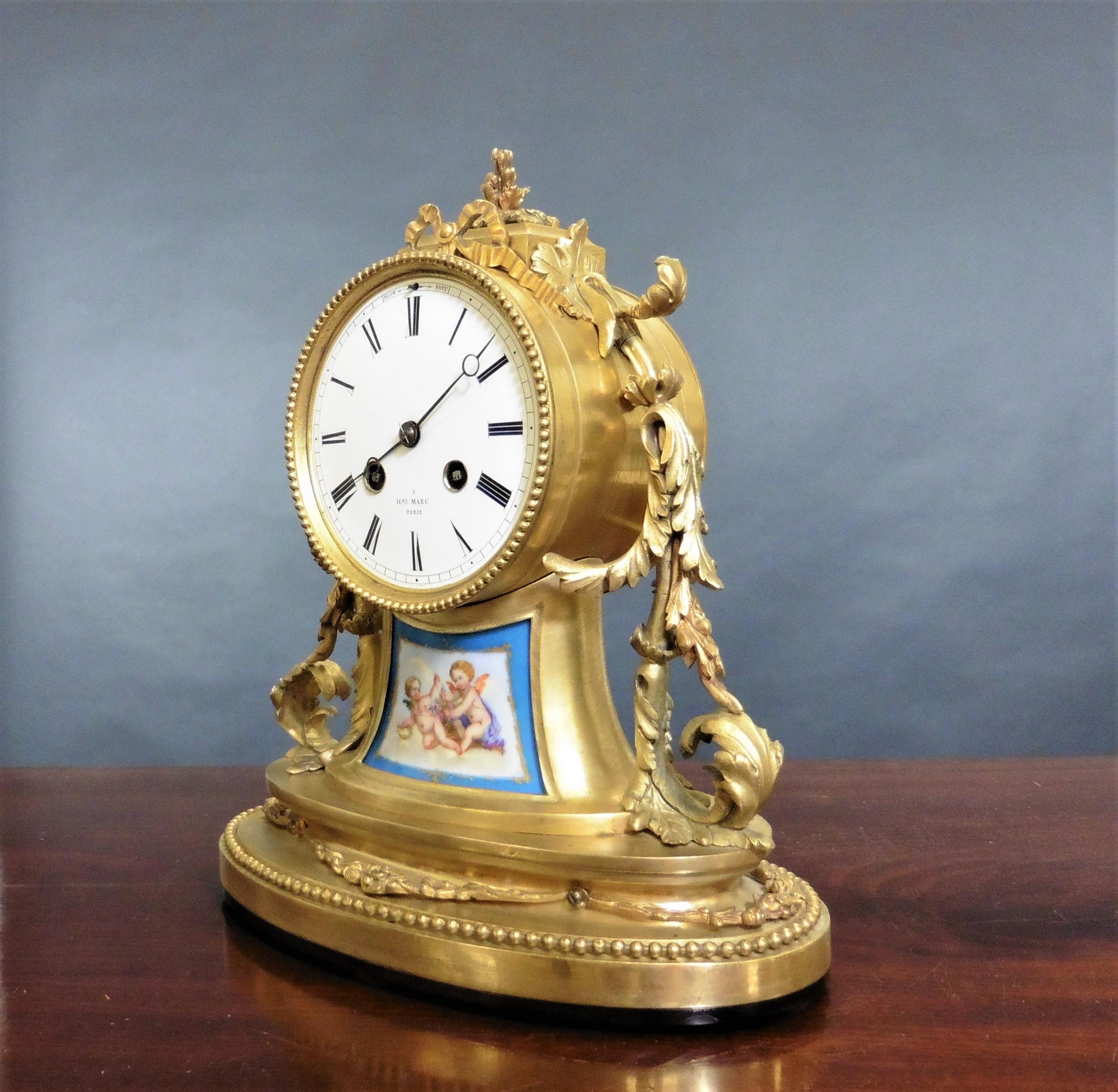 French Ormolu and porcelain mantel clock

French ormolu mantel clock standing on a beaded oval base and resting on a mahogany plinth.

Floral swag decoration to either side of the dial.

The enamel dial with Roman numerals, original ‘blued’ steel