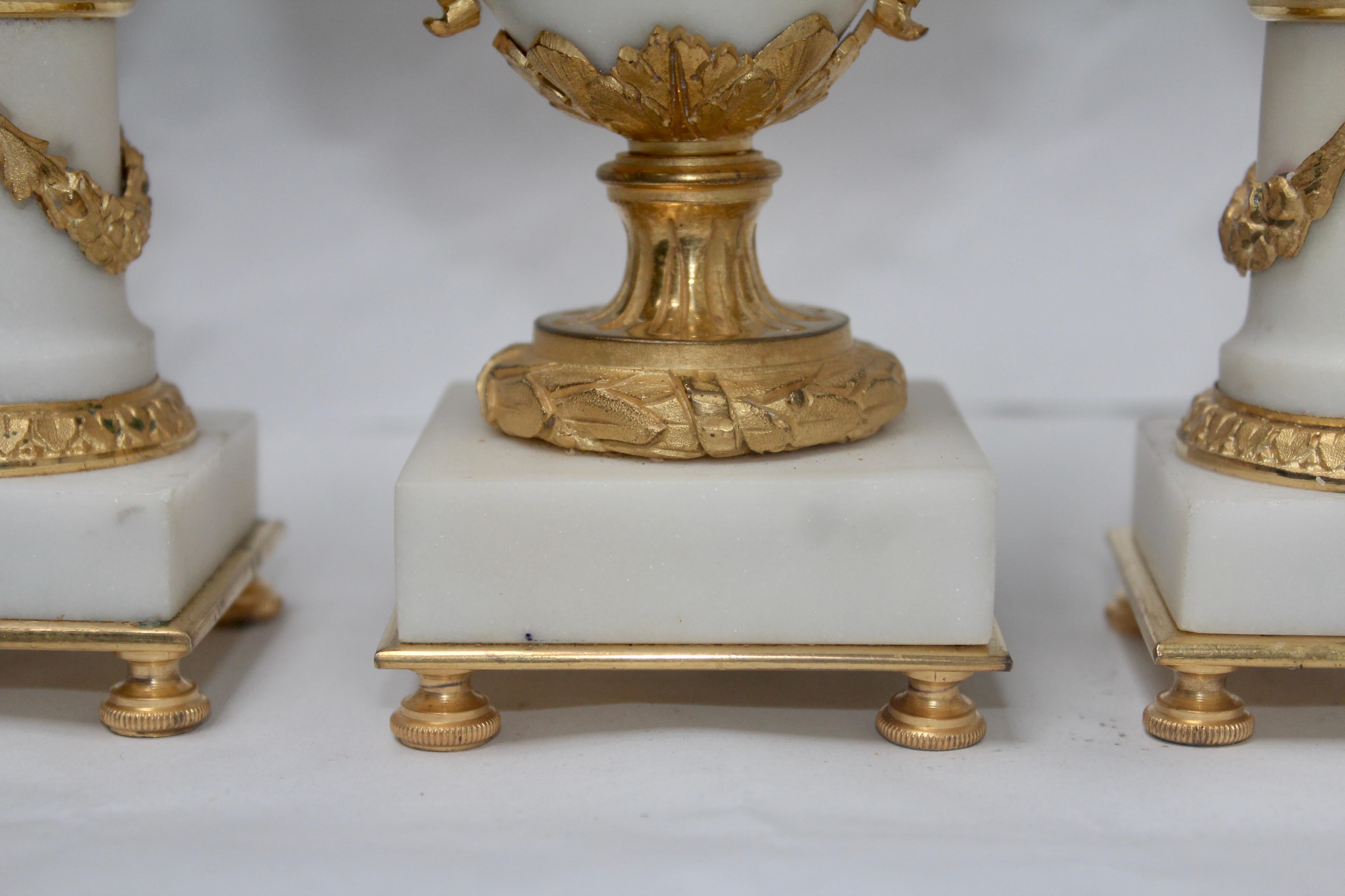 French Ormolu and White Marble Three-Pieces Vase Shaped Clock Garniture 3