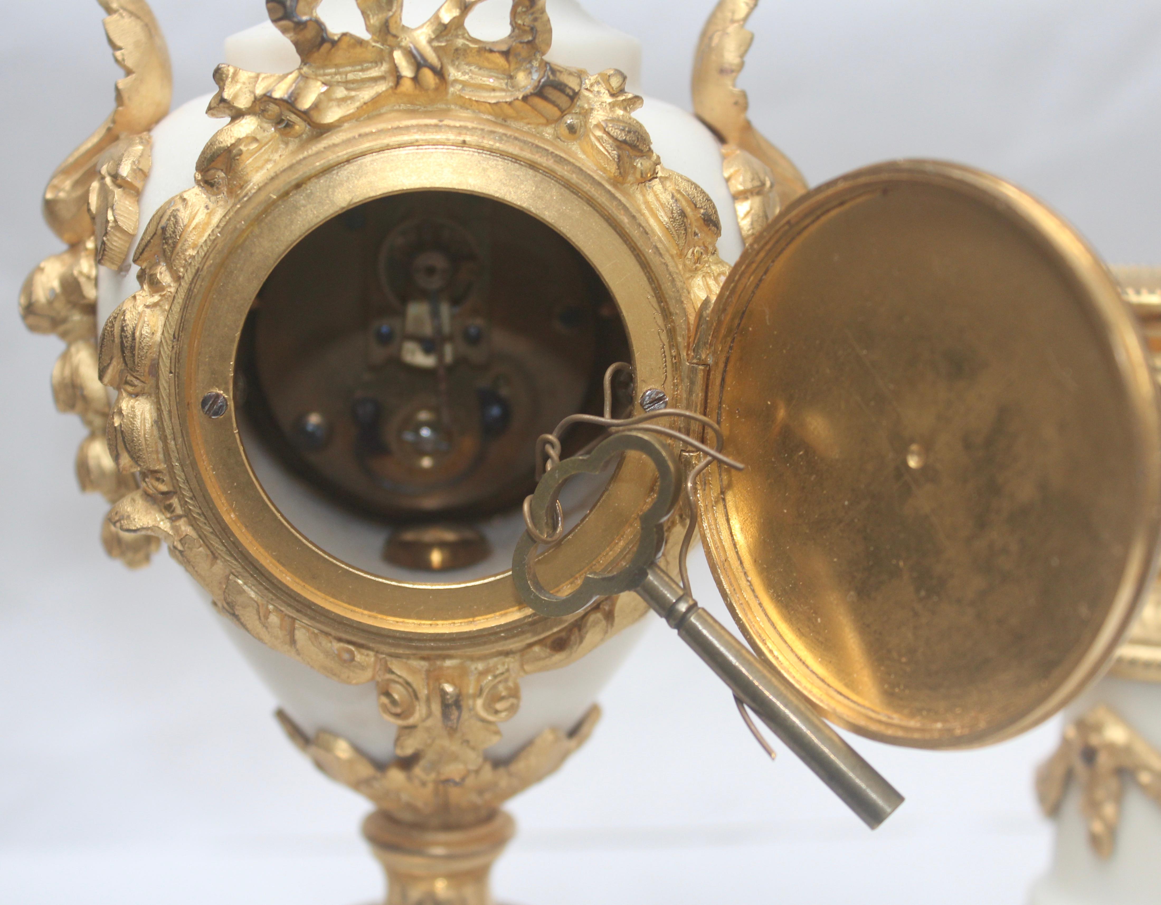 French Ormolu and White Marble Three-Pieces Vase Shaped Clock Garniture 8