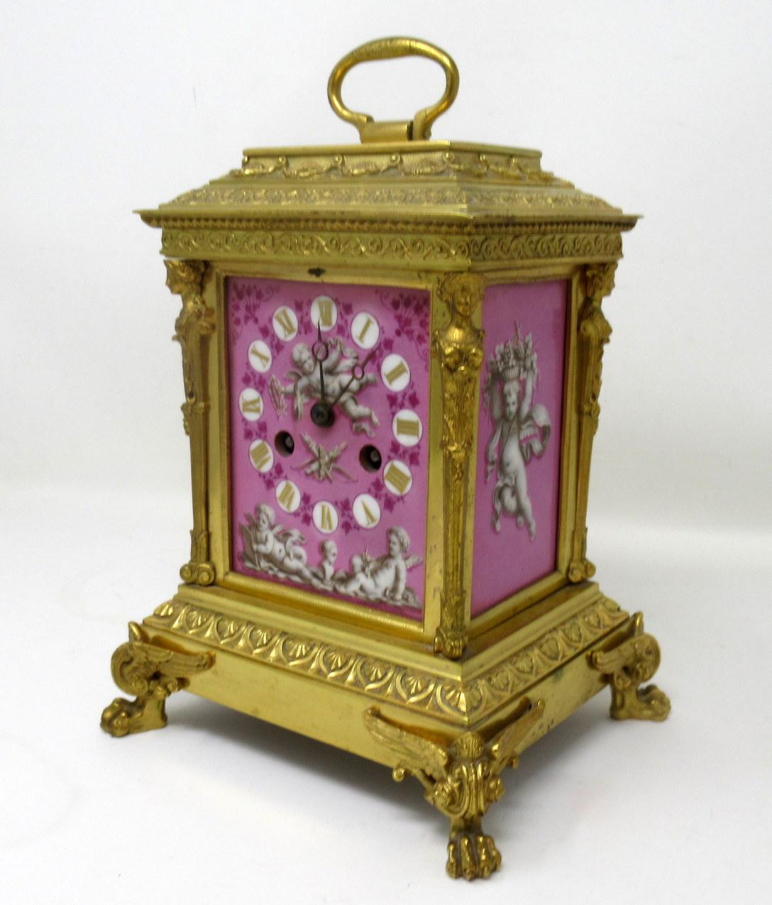 A fine early to mid-nineteenth century French Ormolu and Pampadour pink porcelain carriage or mantle clock of outstanding Quality and compact proportions. 

The circular pink ground enamel dial having gilt brass decorative Roman hour gilt