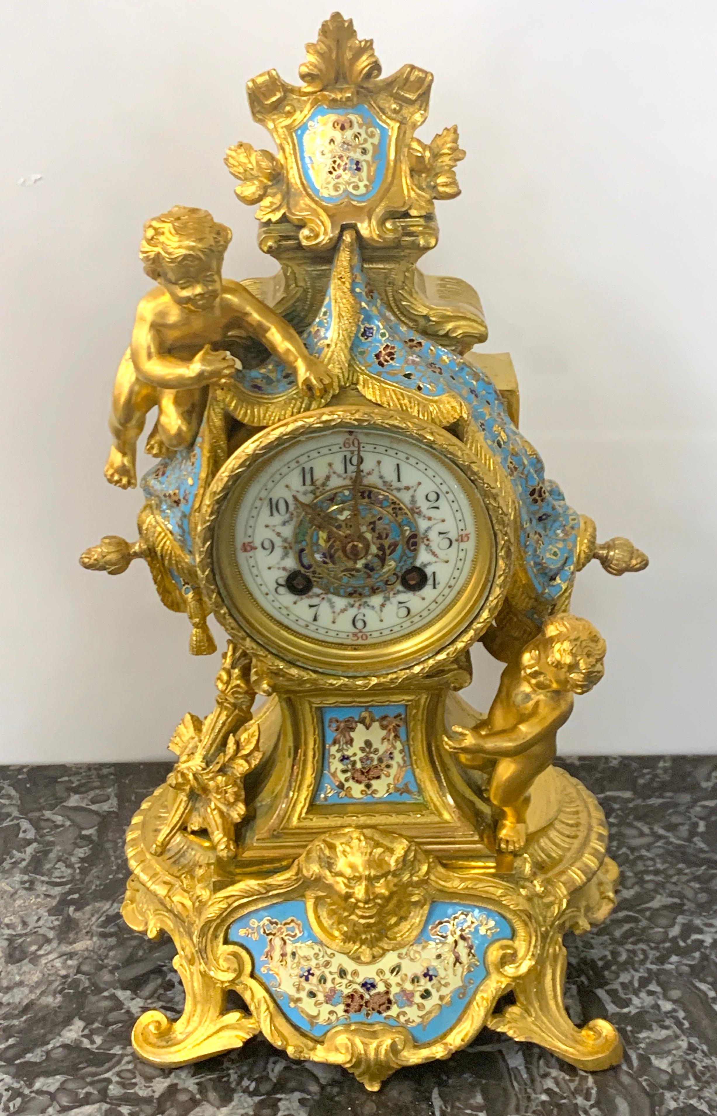 French ormolu & Champlevé enamel draped putti motif clock, Paris, 1890s
Of the best quality, complete with finely enameled clock face the case stamped L.H.
In well cared for antique condition, working. Complete with Key.