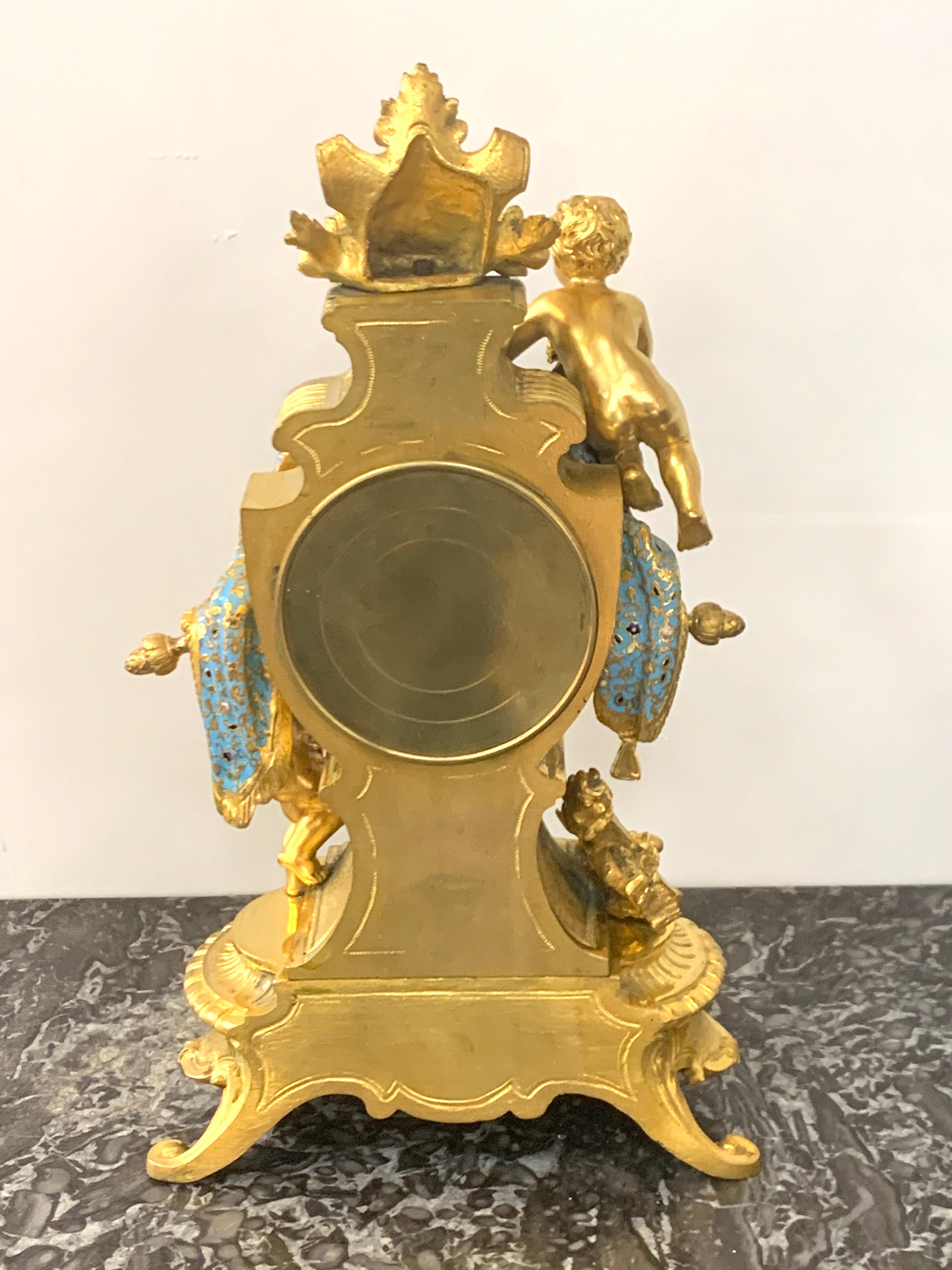 Porcelain French Ormolu & Champlevé Enamel Draped Putti Motif Clock, Paris, 1890s For Sale