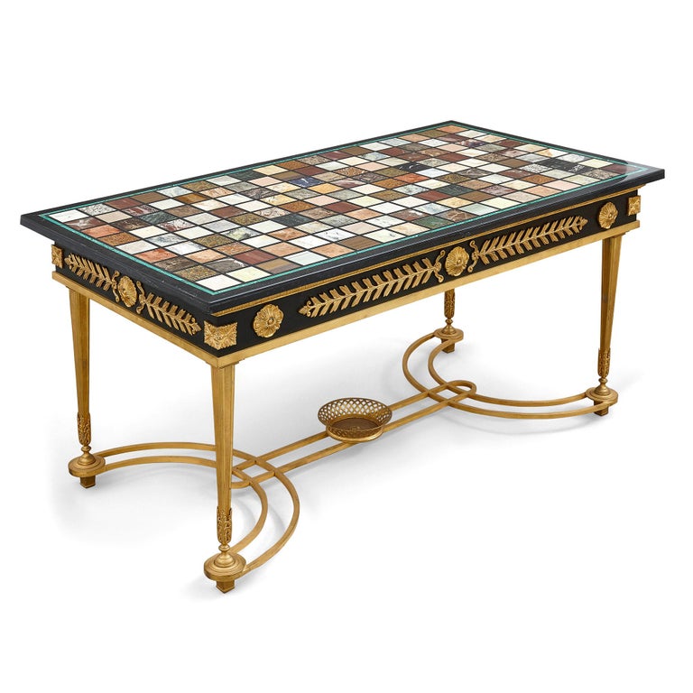 French ormolu coffee table with Italian marble specimen top
French and Italian, 20th Century
Measures: Height 57cm, width 109cm, depth 59cm

Crafted in the timeless neoclassical style, this coffee table features the best of Italian and French