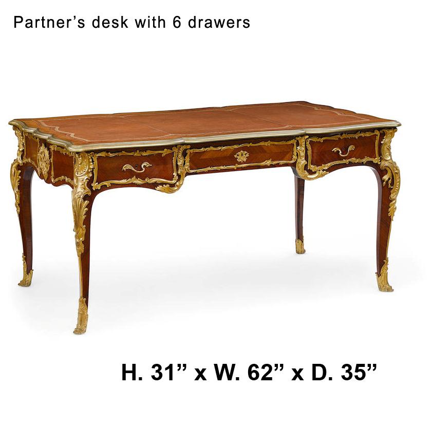 Spectacular and unique 19th century French Louis XV style ormolu-mounted Kingwood partner's desk.
The shaped top is with an inset tooled leather writing surface and an ormolu border, over a veneered kingwood frieze fitted with three drawers to each