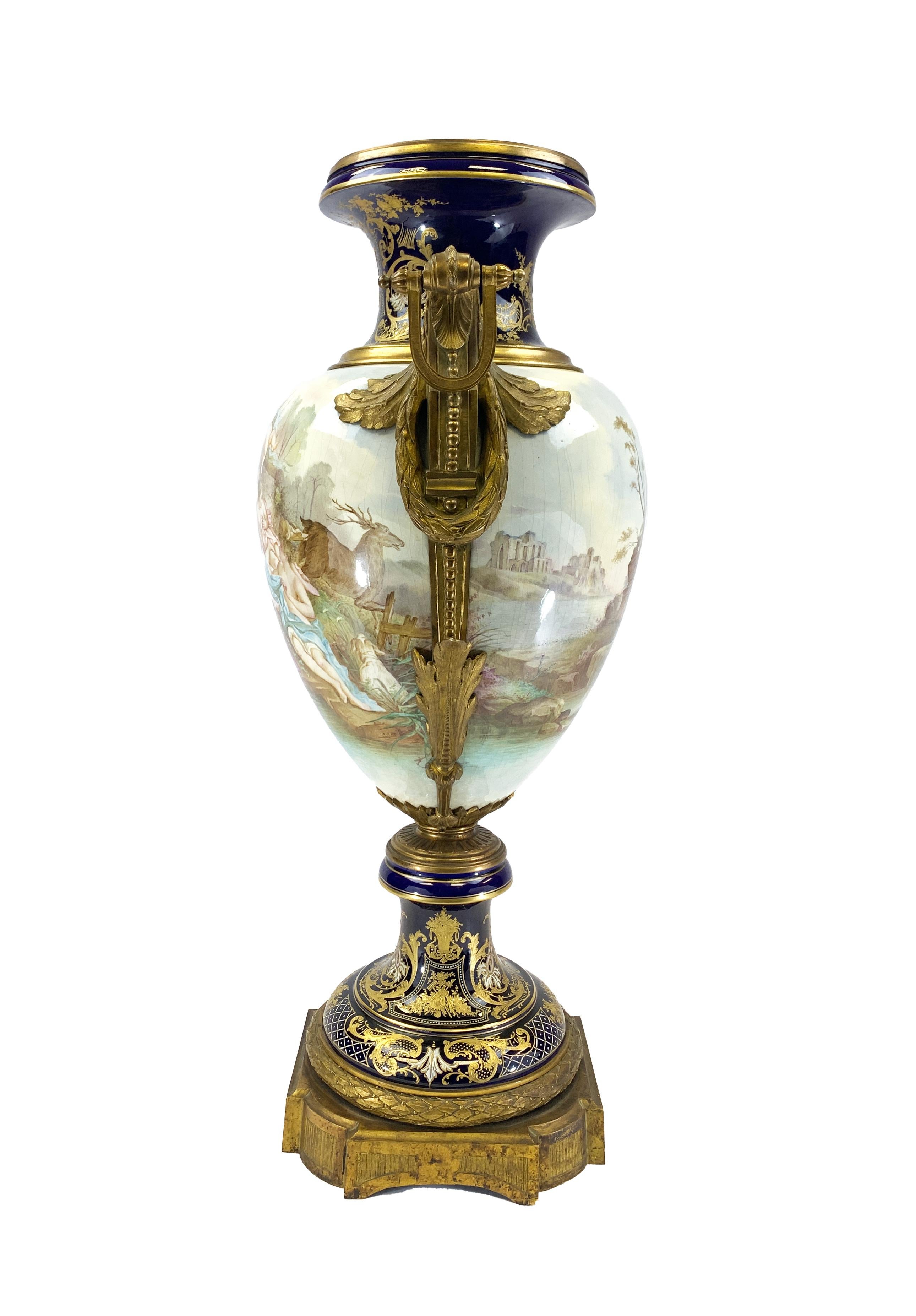 Impressive 19th century French Sevres style porcelain vase no lid, raised on a square ormolu base, The front panel is hand painted to represent a mythological scene, Gilt bronze handles are attached to the vase, Signed by the artist Collot. 
 