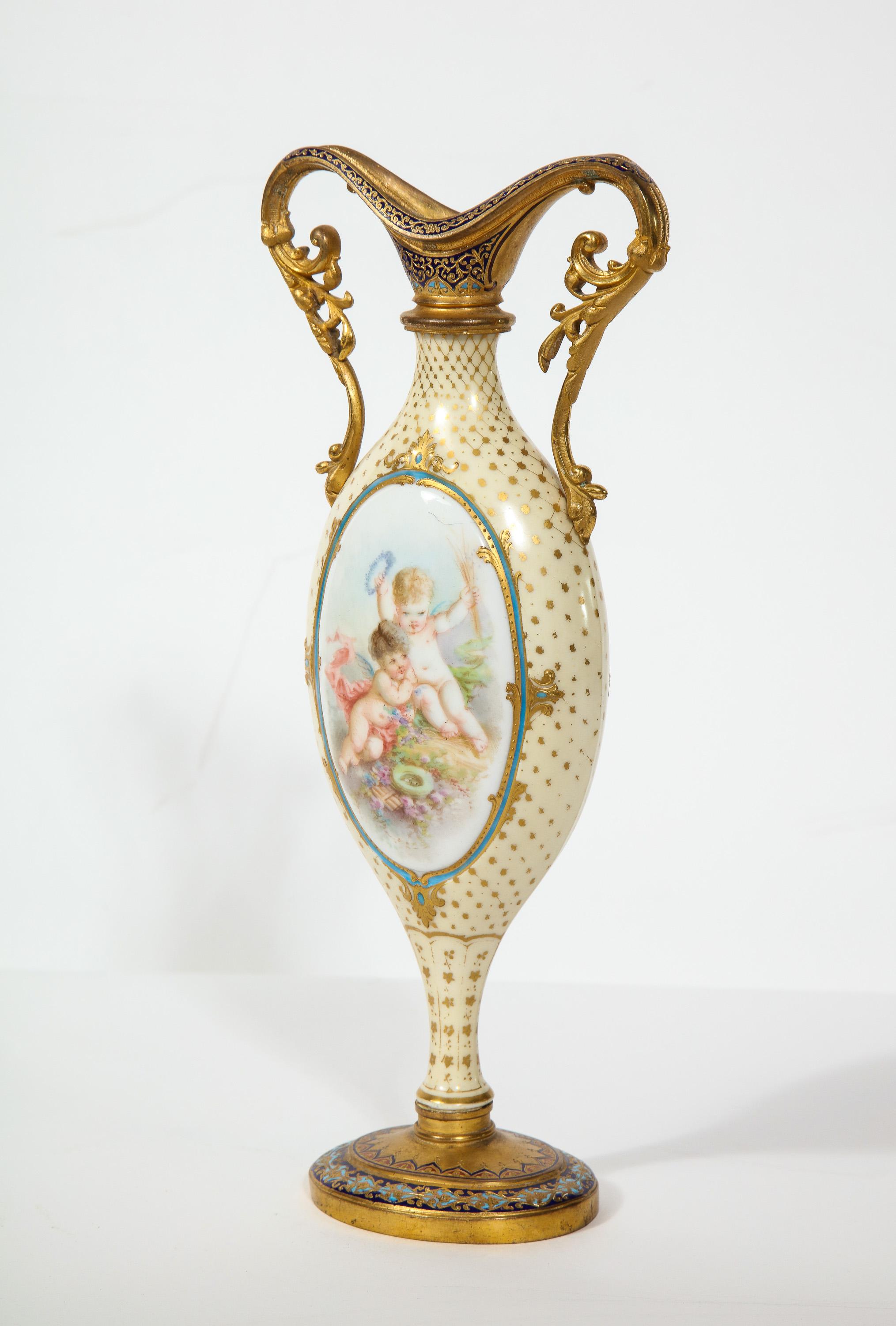 French ormolu-mounted white Sevres porcelain and champlevé enamel vase, circa 1880

Very nice quality, twin handled vase. hand painted with cherubs and flowers and trophies.

Measures: 11