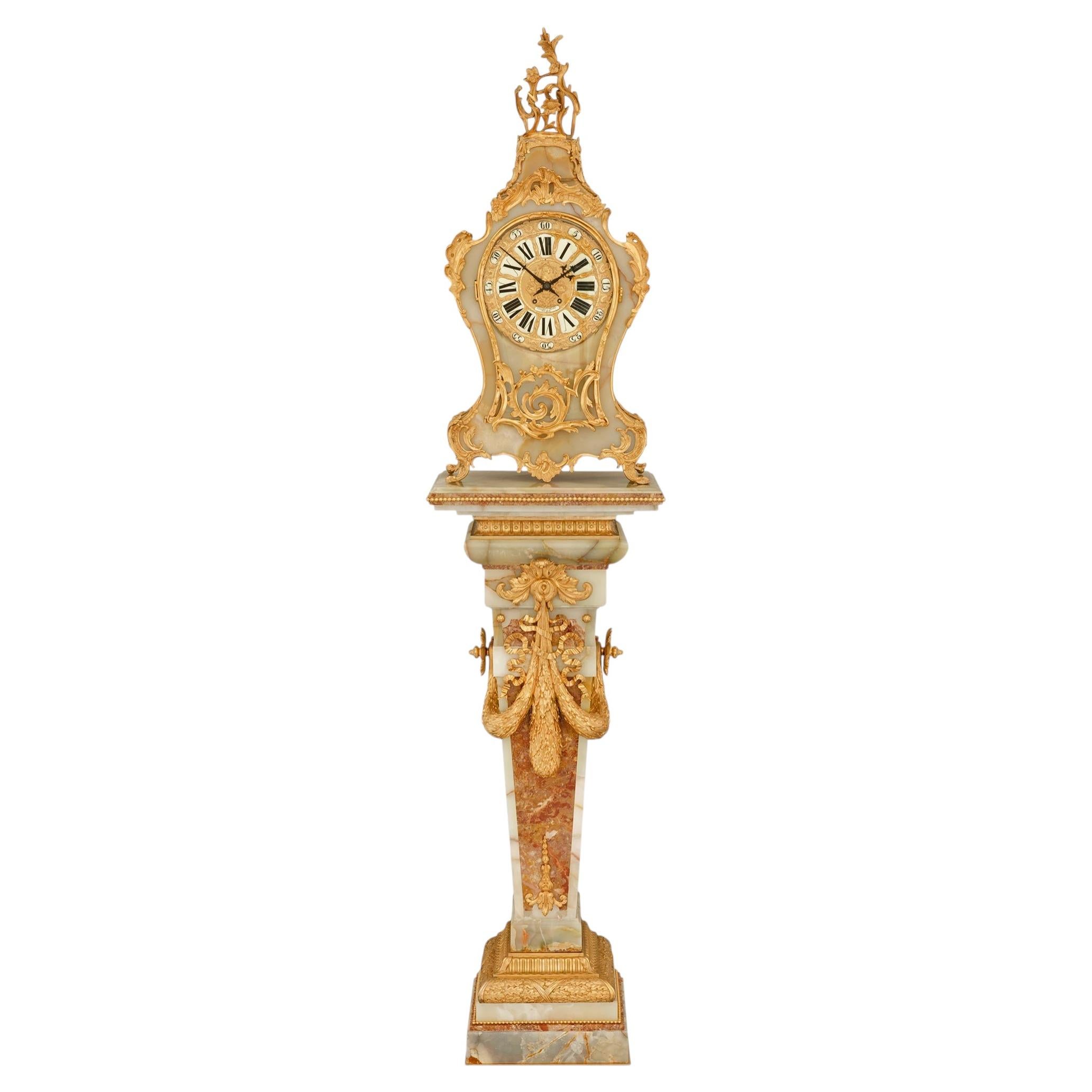 French Ormolu, Onyx and marble clock & pedestal, retailed by Camerden & Forster
