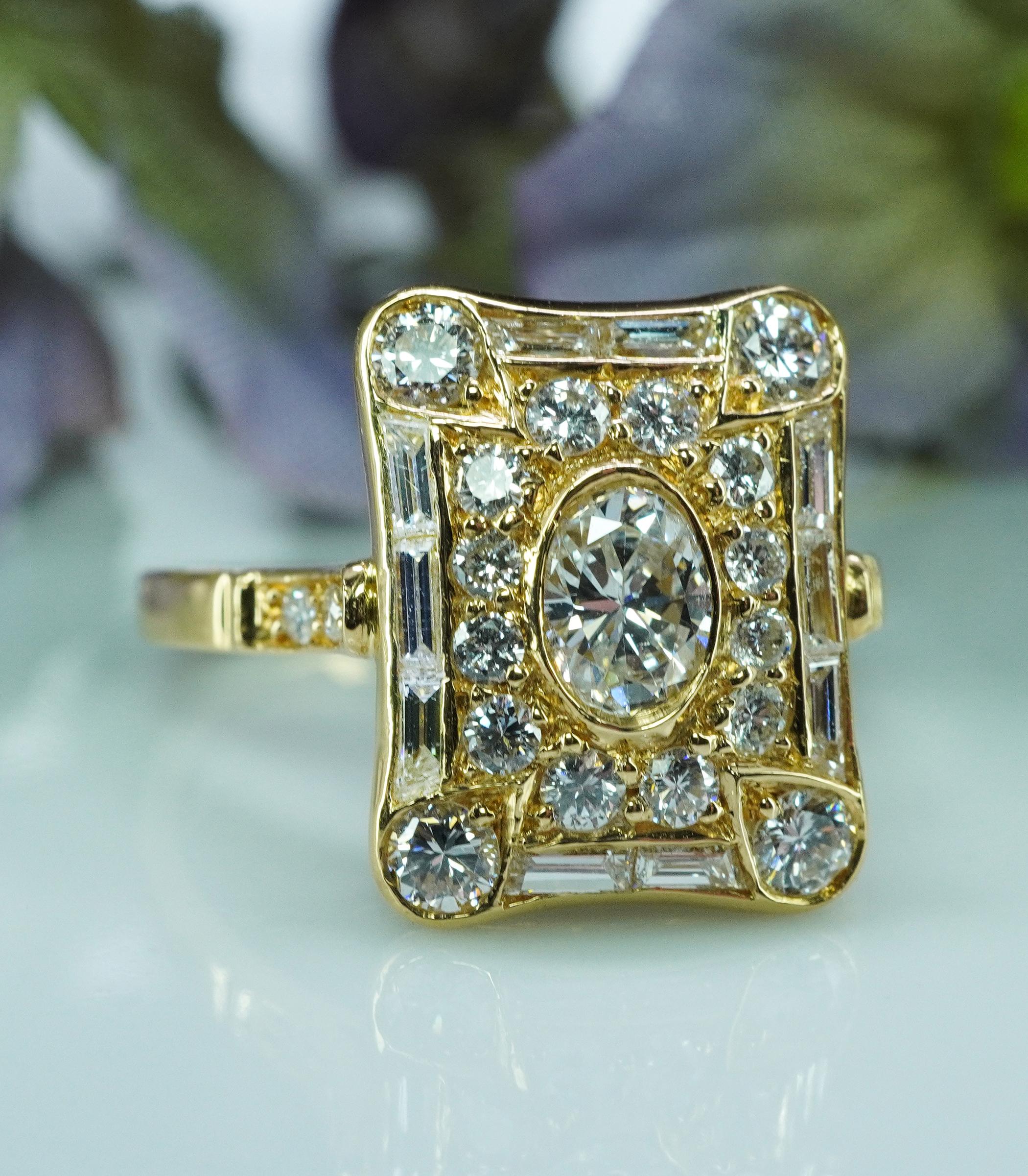 French Oval Baguette Diamond 18K Gold Picture Frame Ring Vintage Estate 

This fine estate vintage piece holds oval cut diamond in the center. The center stone is measuring 5.17mm x 3.77mm, it is estimated to be 30 carat. This oval diamond is