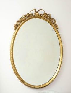 French Oval Gilt Mirror with Bow Crest, 1860