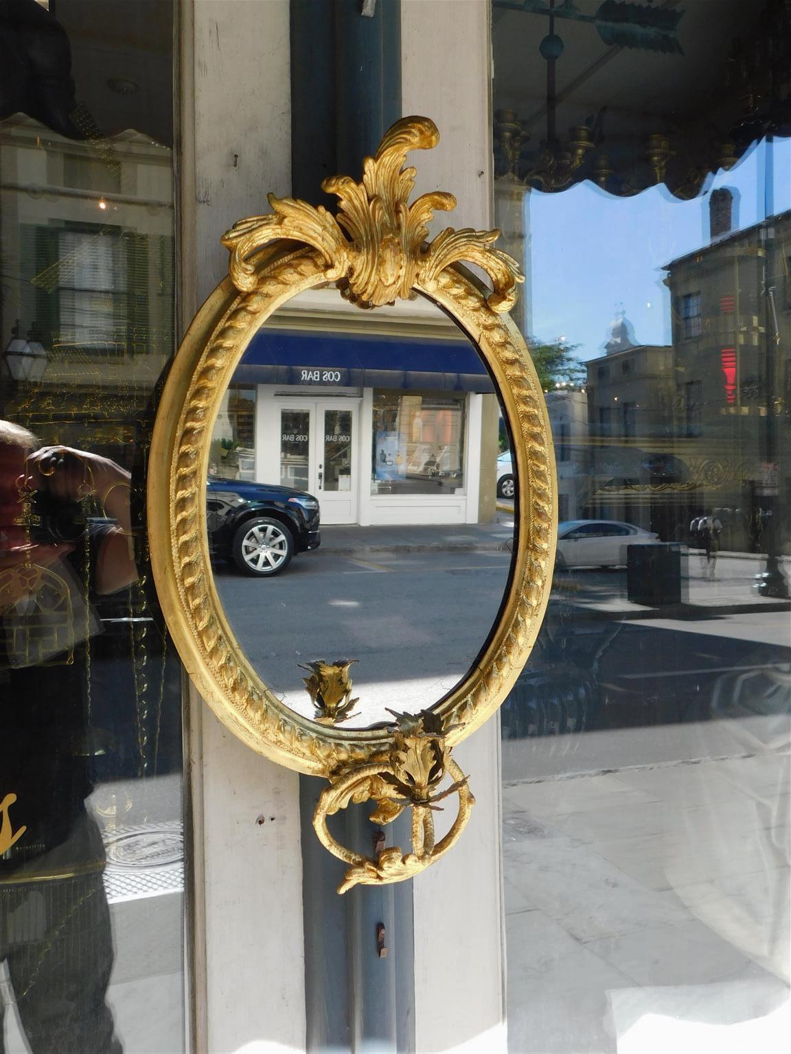 Louis XVI French Oval Gilt Wood & Gesso Foliage Crest Candle Arm Wall Mirror, Circa 1790 For Sale