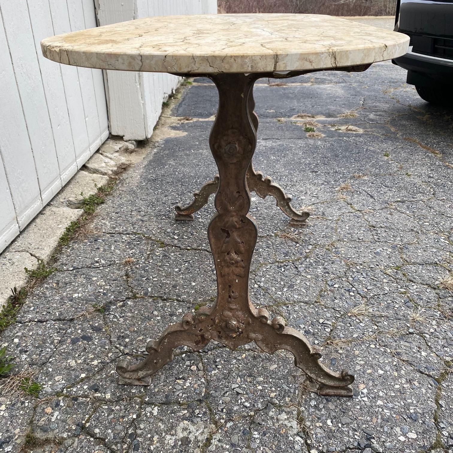 French Provincial French Oval Marble Top Cafe Table with Exceptional Metal Base  For Sale