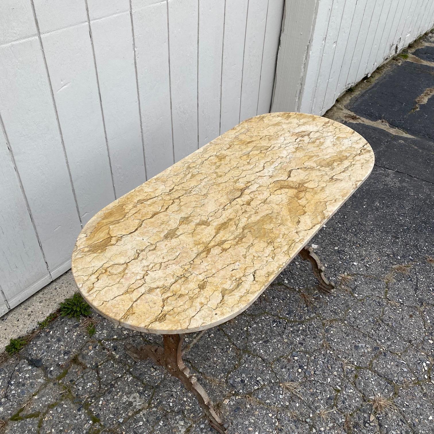 19th Century French Oval Marble Top Cafe Table with Exceptional Metal Base  For Sale