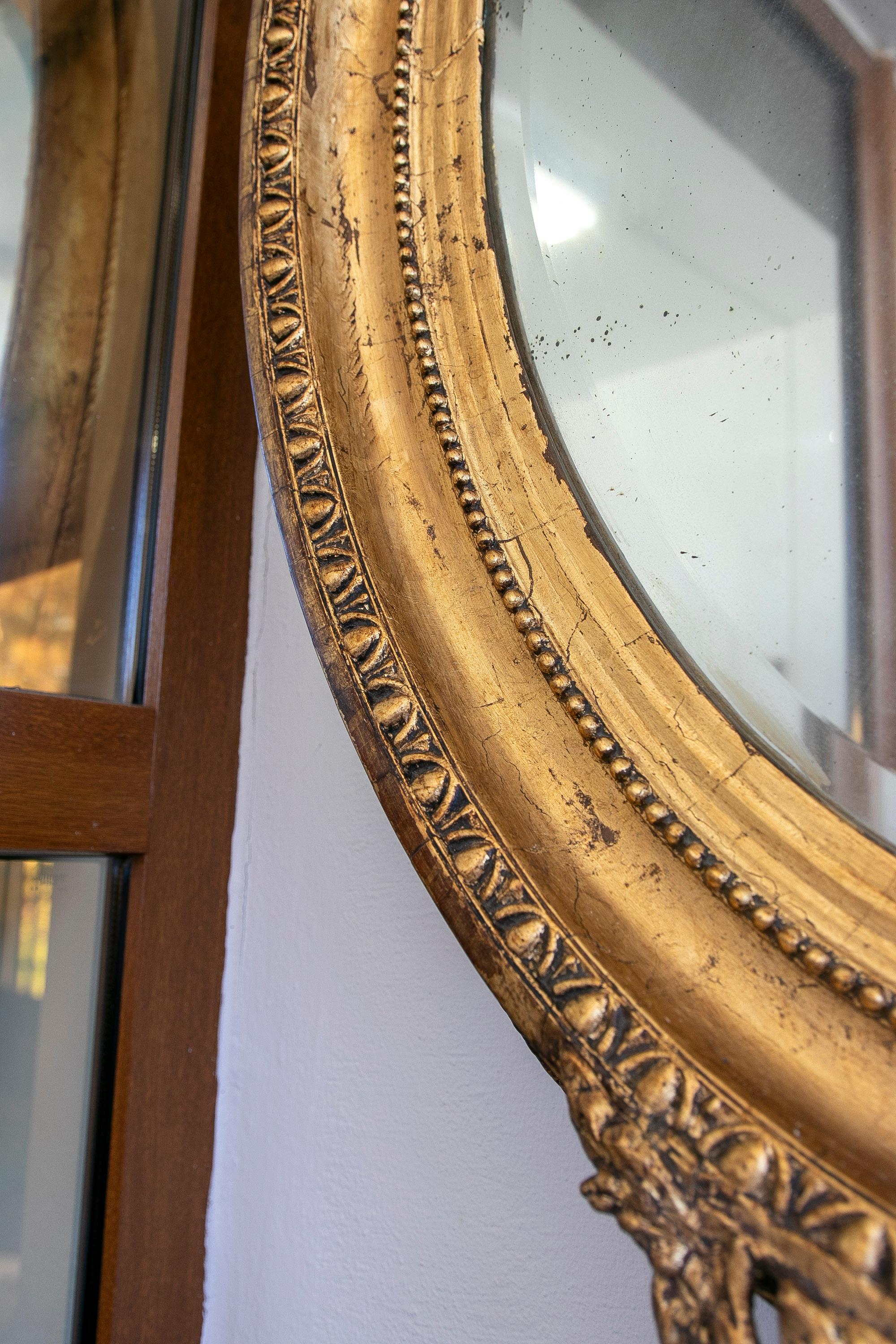 French Oval Mirror with Gold Tones and Flower Garland Coping For Sale 1