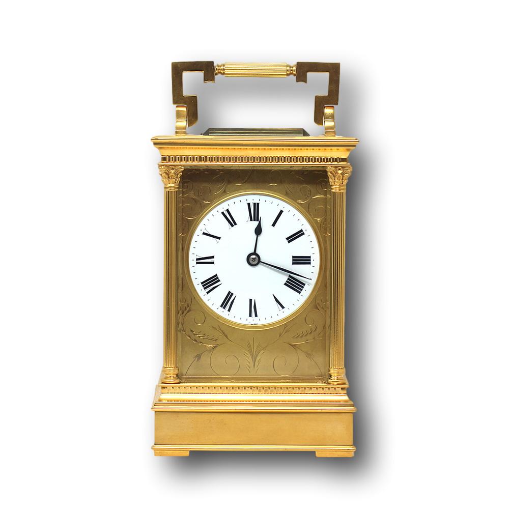 French late 19th century oversized carriage clock. The clock professionally cleaned and serviced complete with winding key in excellent working order. Engraved to the front with scrolling motifs around the white enamelled dial with roman numerals.