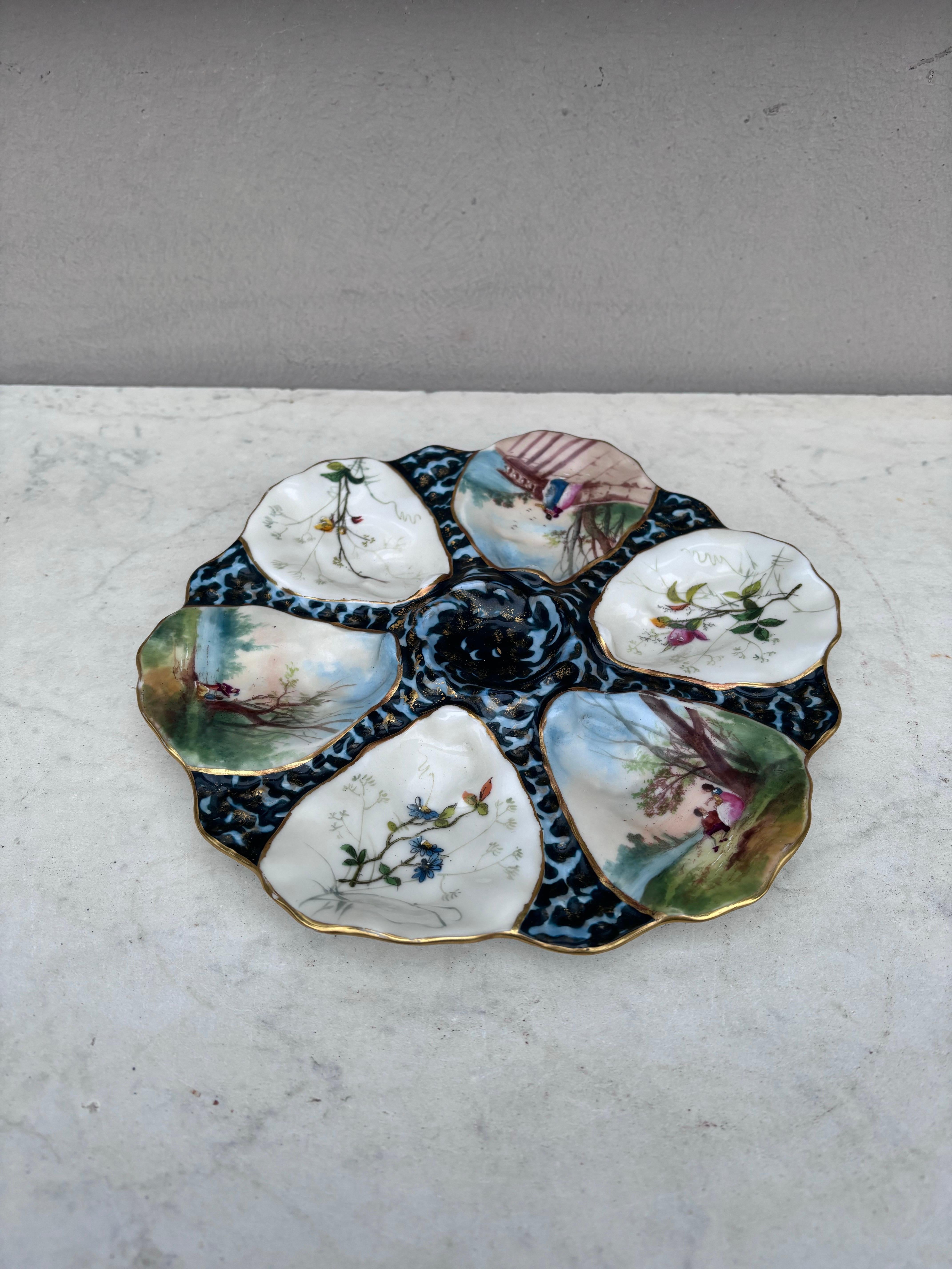 Piatto ostrica francese in porcellana Fiori Limoges circa 1900. 