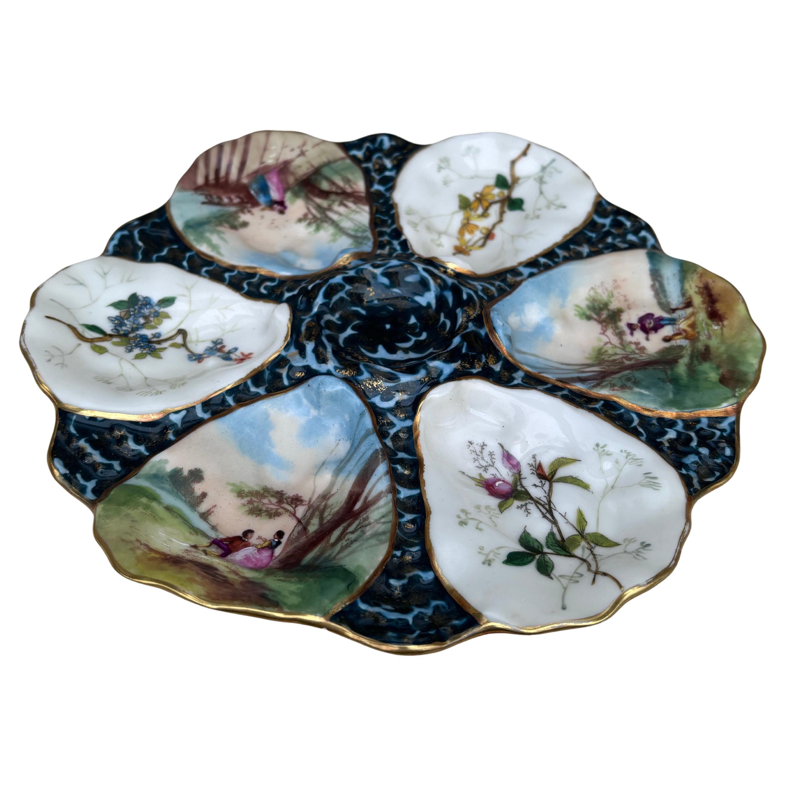 Piatto ostrica francese in porcellana Fiori Limoges circa 1900.