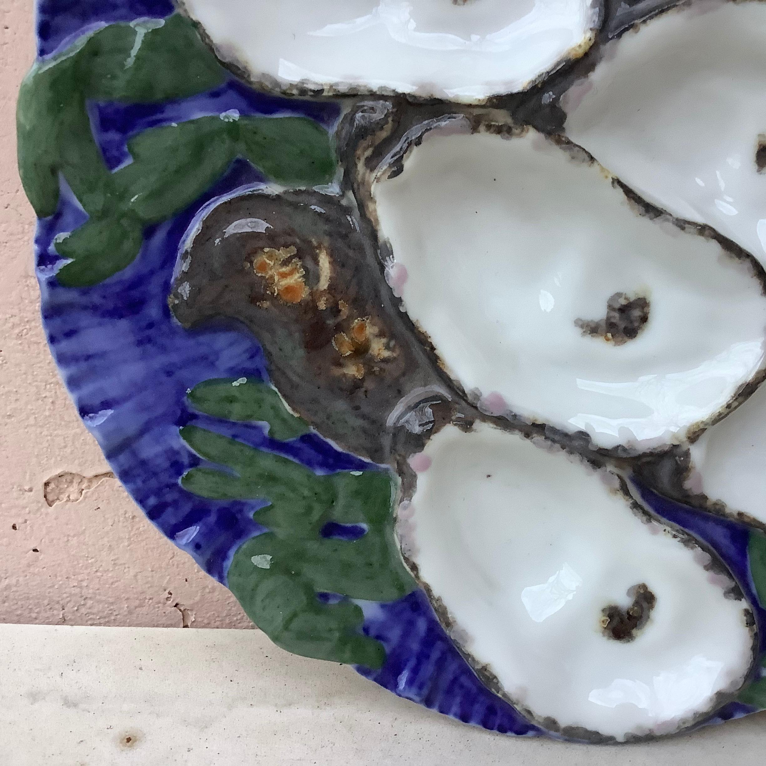 Antique 19th century French porcelain oyster plate with the turkey pattern signed Limoges Haviland.