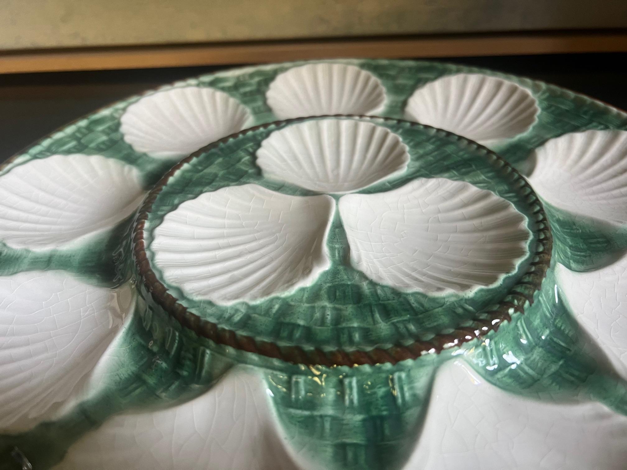 Large oyster / seafood platter made in France by Longchamp. Includes 12 wells, three of which are raised for lemon wedges.