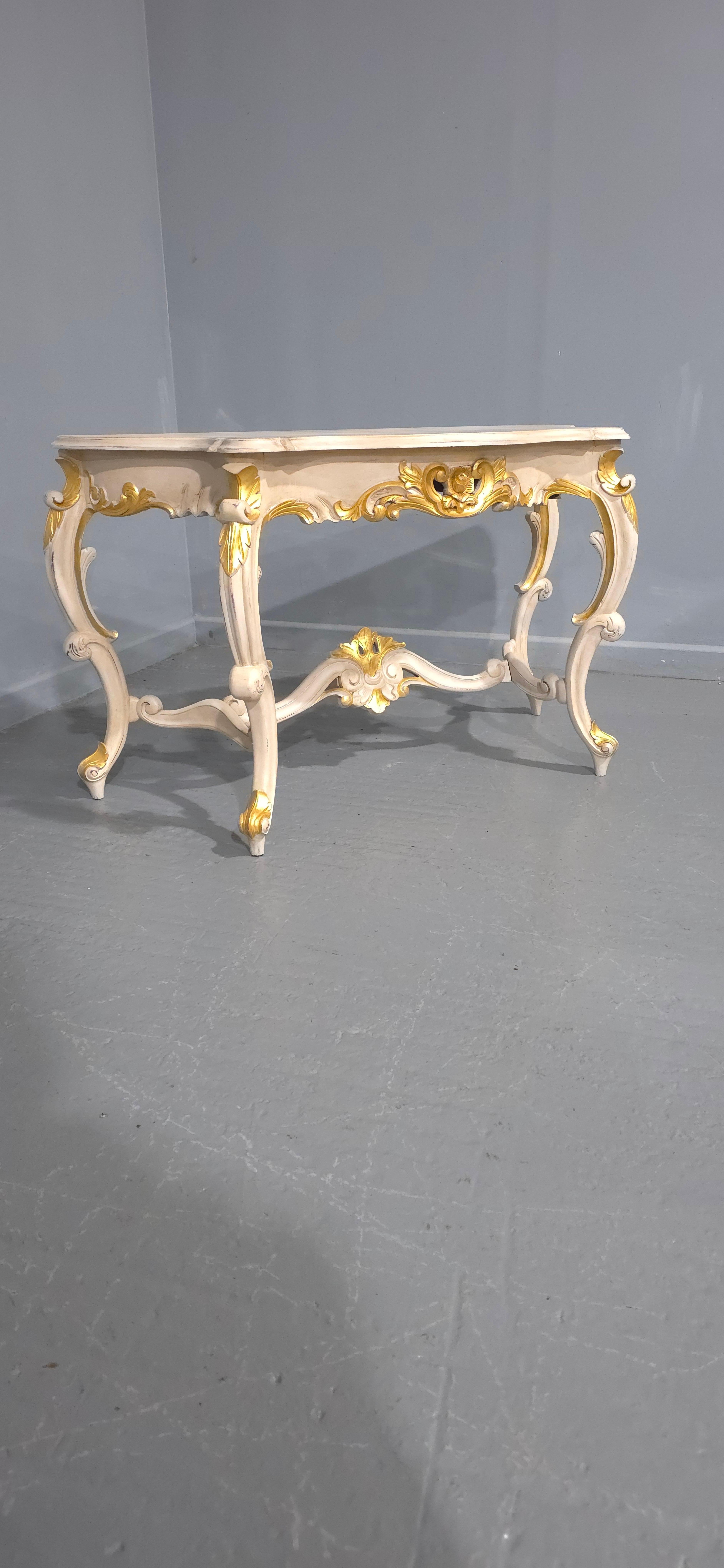 A  very good French console table, painted in dark cream with parcel gilding, in very good overall condiiton.

29