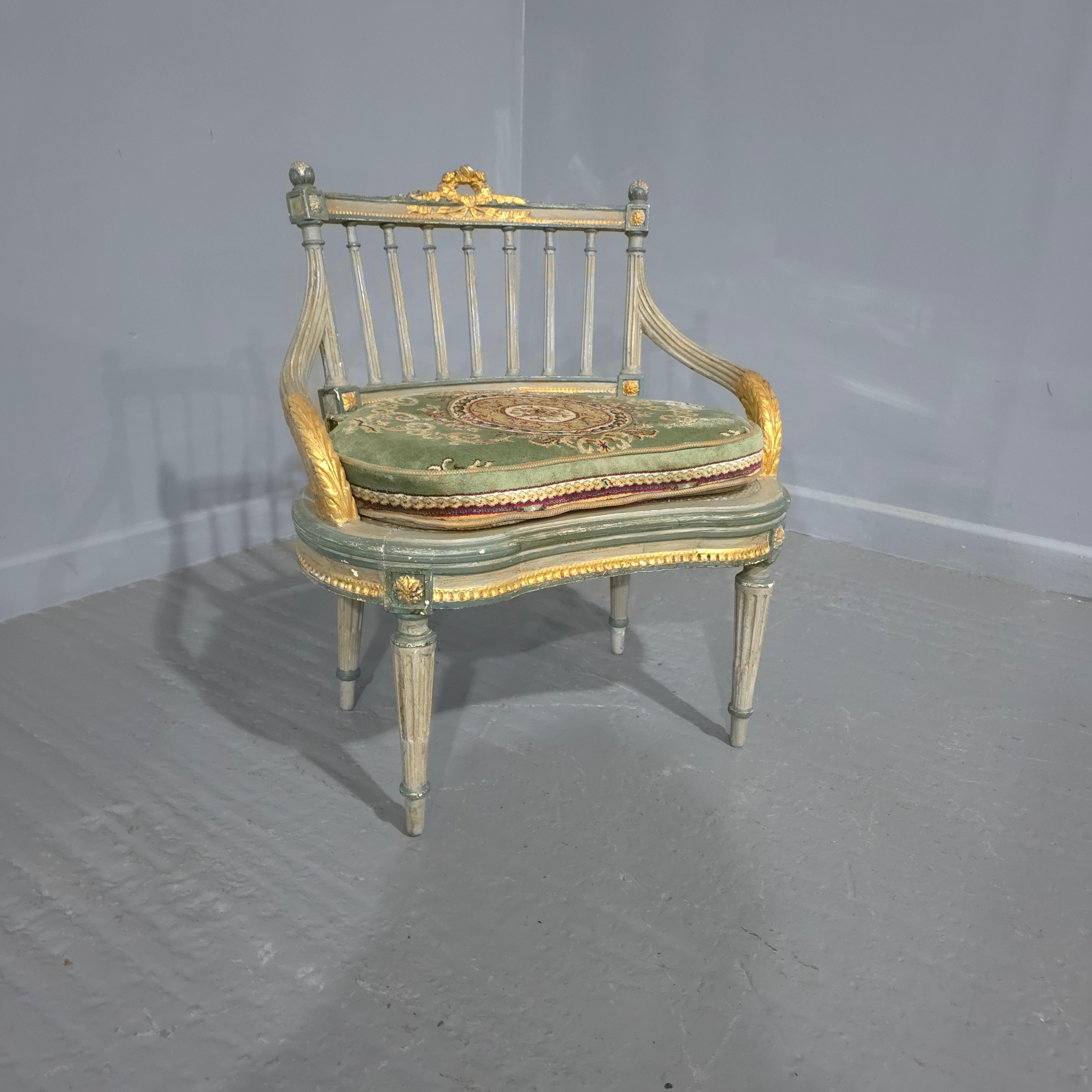A blue painted and parcel gilded French bergere boudoir chair with original deep pile chair pad, in very good overall condition.

28