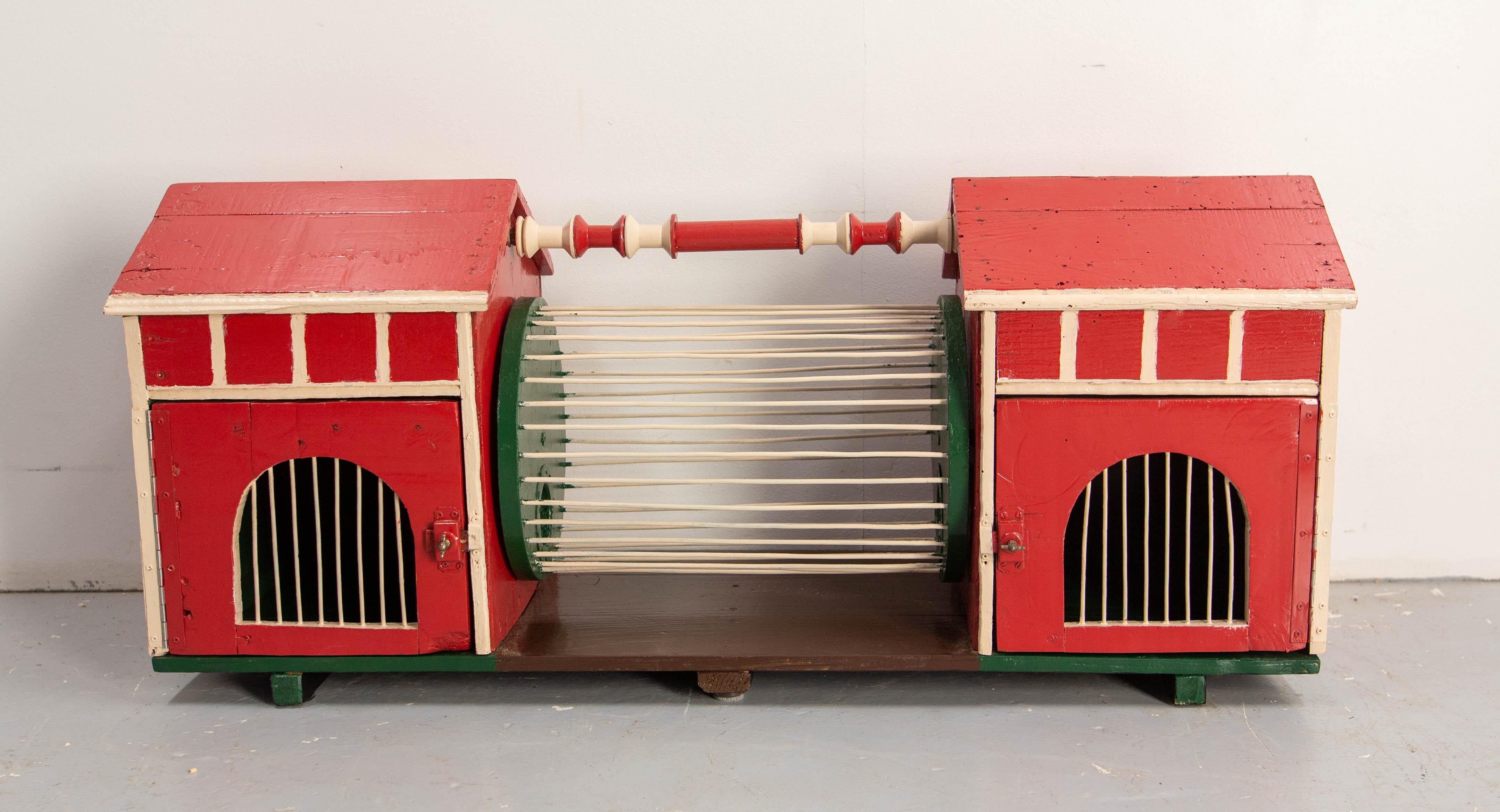French pair of two garden houses for little pets. This can be kept in the house or be placed in the garden. 
It his composed of two little houses from which the fart can access a wheel.
The wheel access holes measure 1.97 in. (5 cm) in diameter.
Red