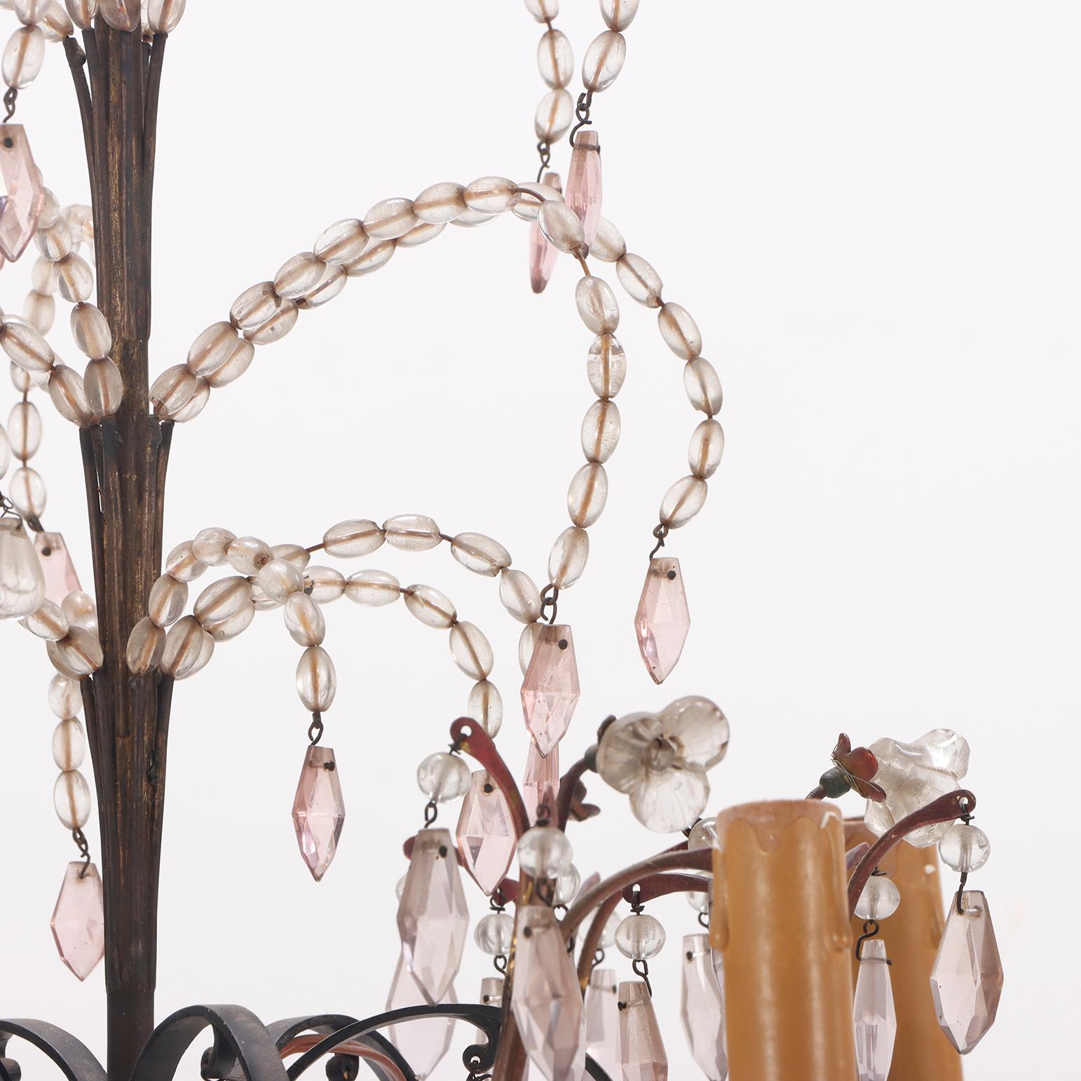 Painted French painted iron and beaded chandelier in the manner of Bagues C 1940. For Sale