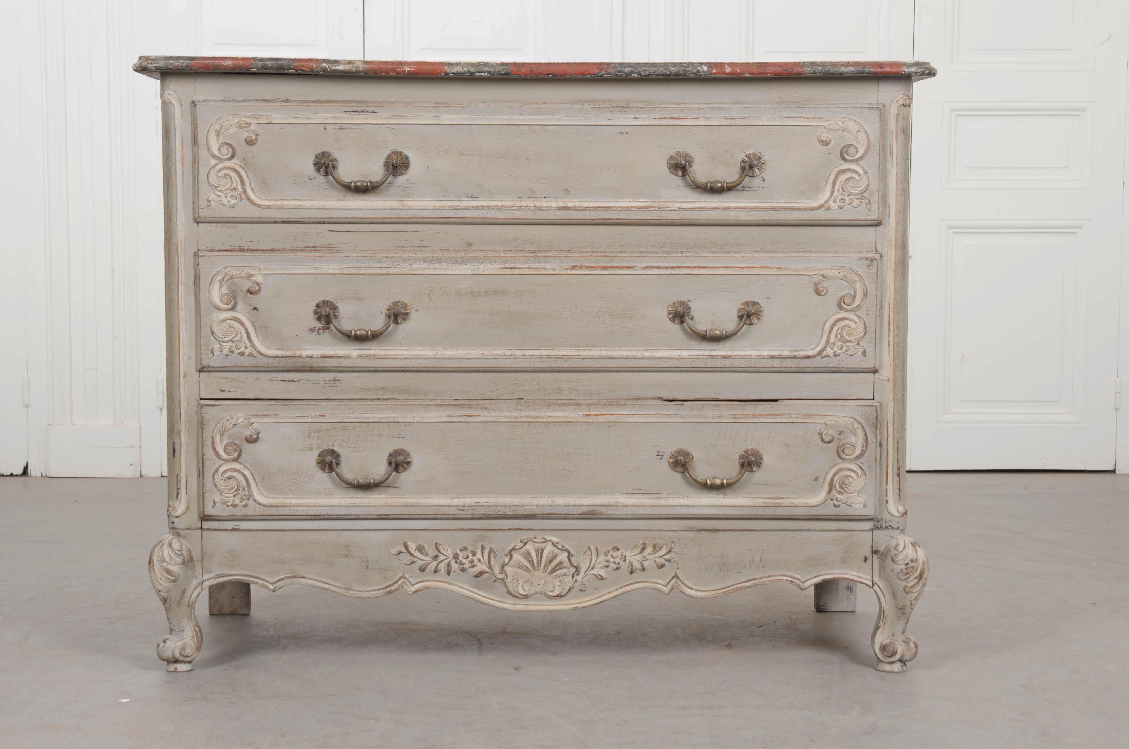 French painted Louis XV style commode with faux marble top, wonderful carvings, classic to the style. Early 1900s.