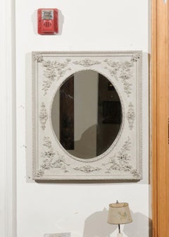 French Painted Mirror with Carved Floral Décor and Oval Twisted Ribbon Molding