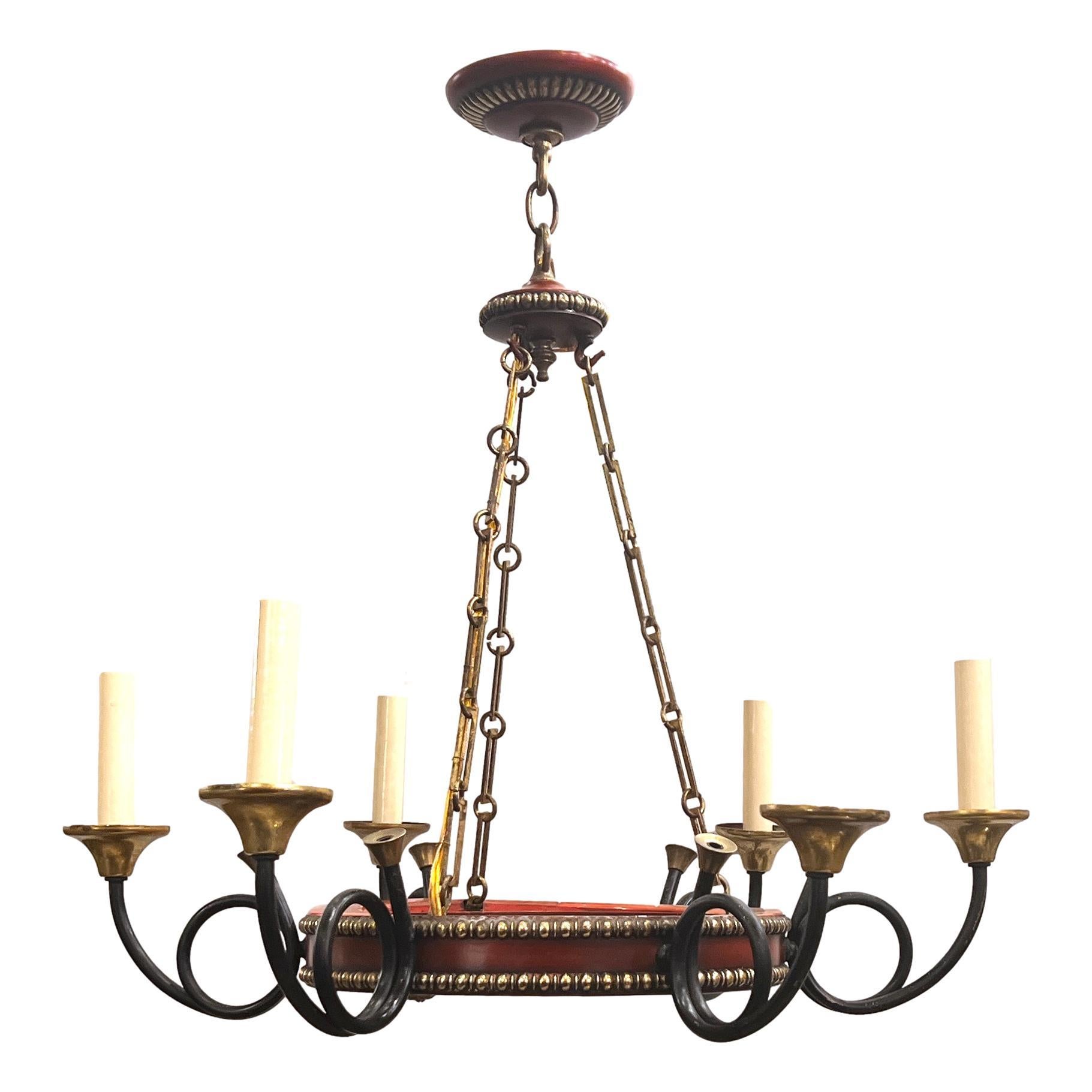 A circa 1950's French painted tole and gilt bronze chandelier.

Measurements:
Drop: 25