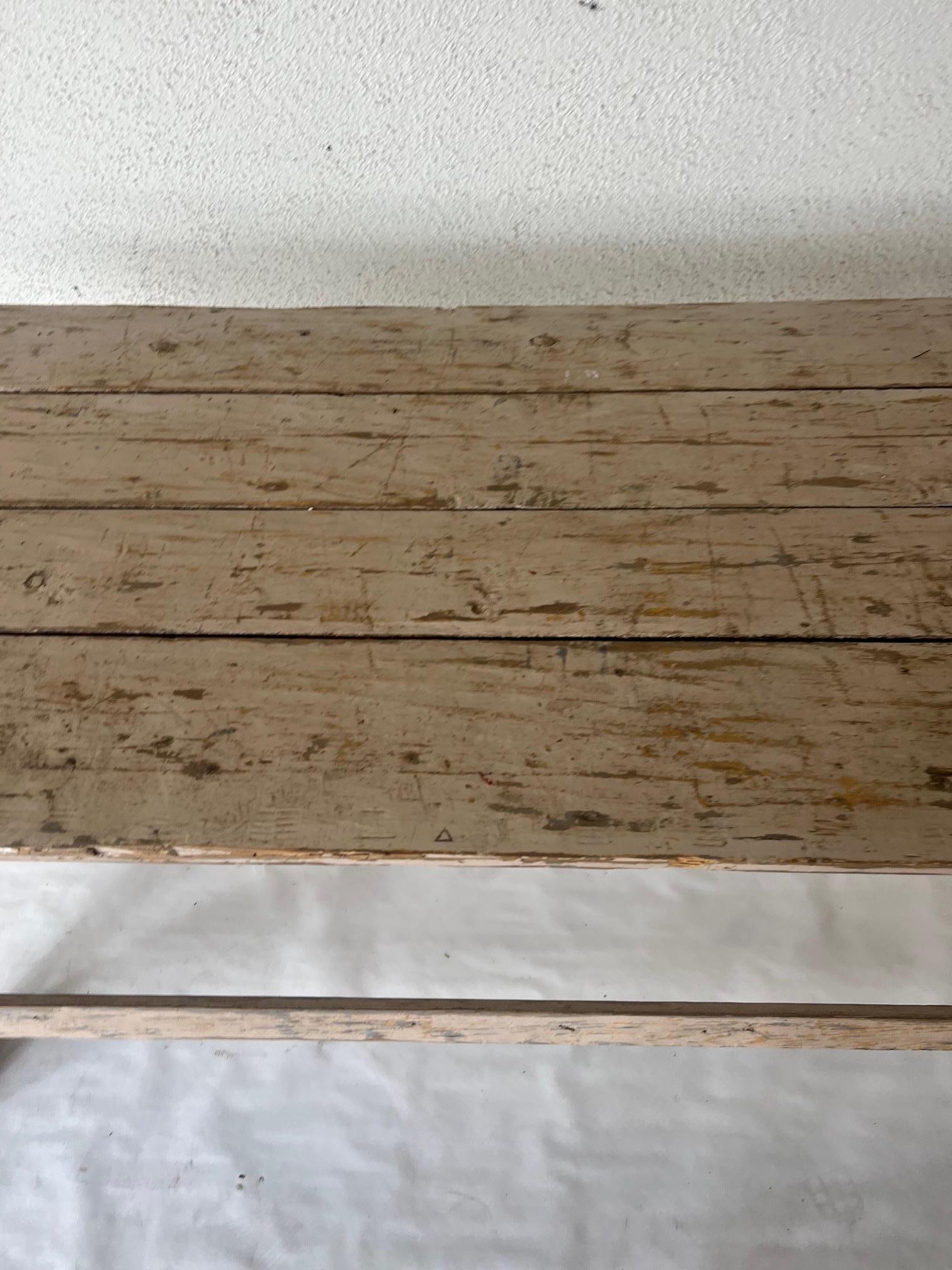 French painted sand lock table with stretcher. Plank top table rustic in age.