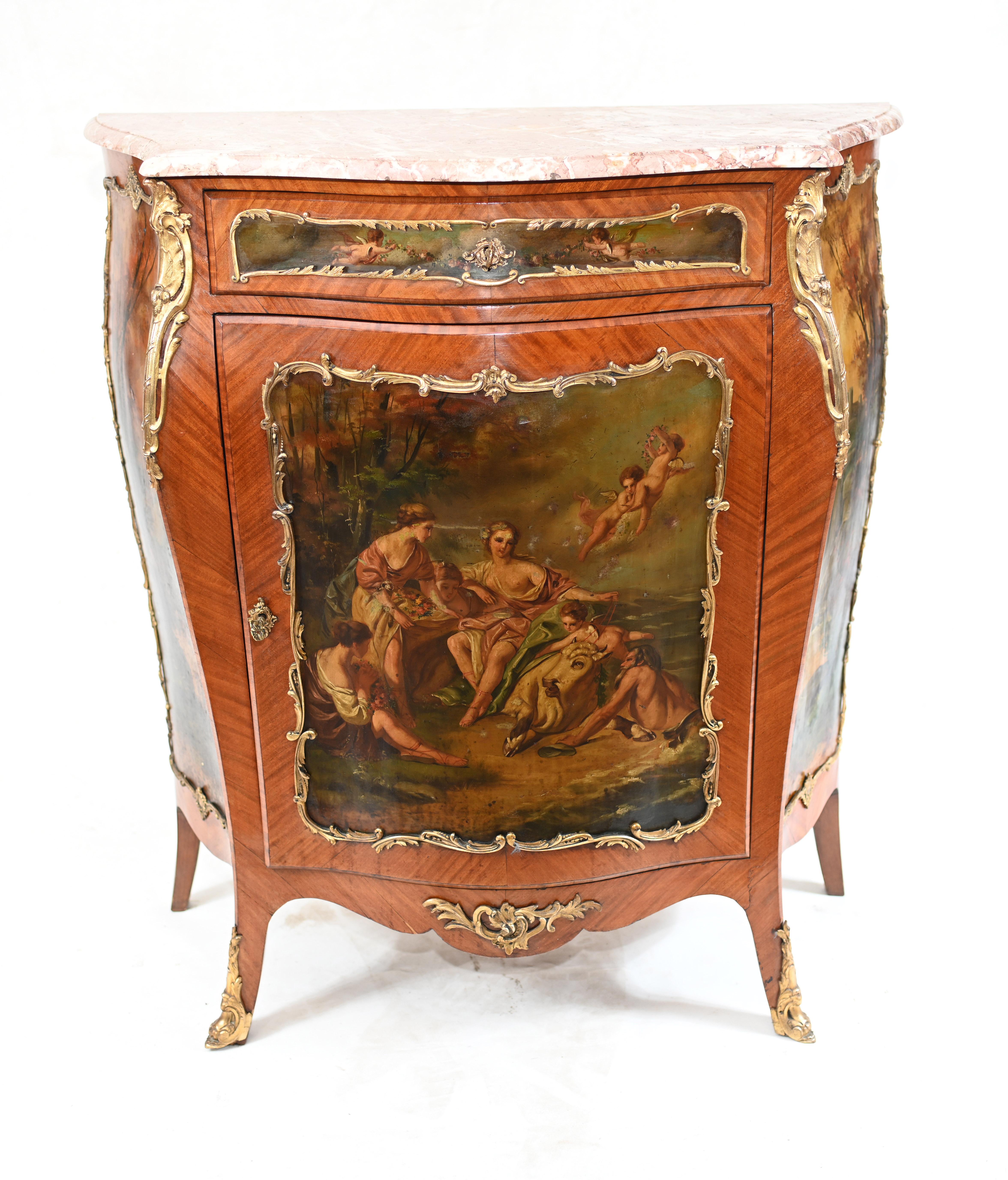 Gorgeous hand painted French side cabinet we date to circa 1890
Features intricate hand painted panels in the manner of Vernis Martin
Scenes include classical scenes with toga clad females, very detailed
Purchased on the Roue de Rossiers at the