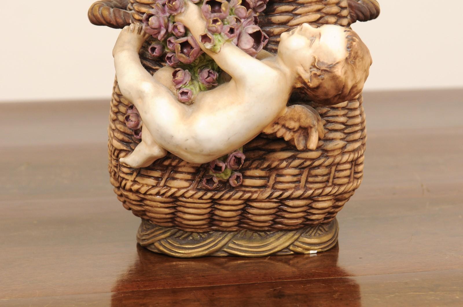 19th Century French Painted Terracotta Wicker Basket Vase with Cherub Swinging from Roses For Sale