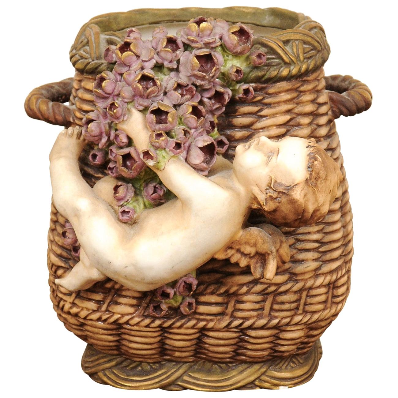 French Painted Terracotta Wicker Basket Vase with Cherub Swinging from Roses For Sale