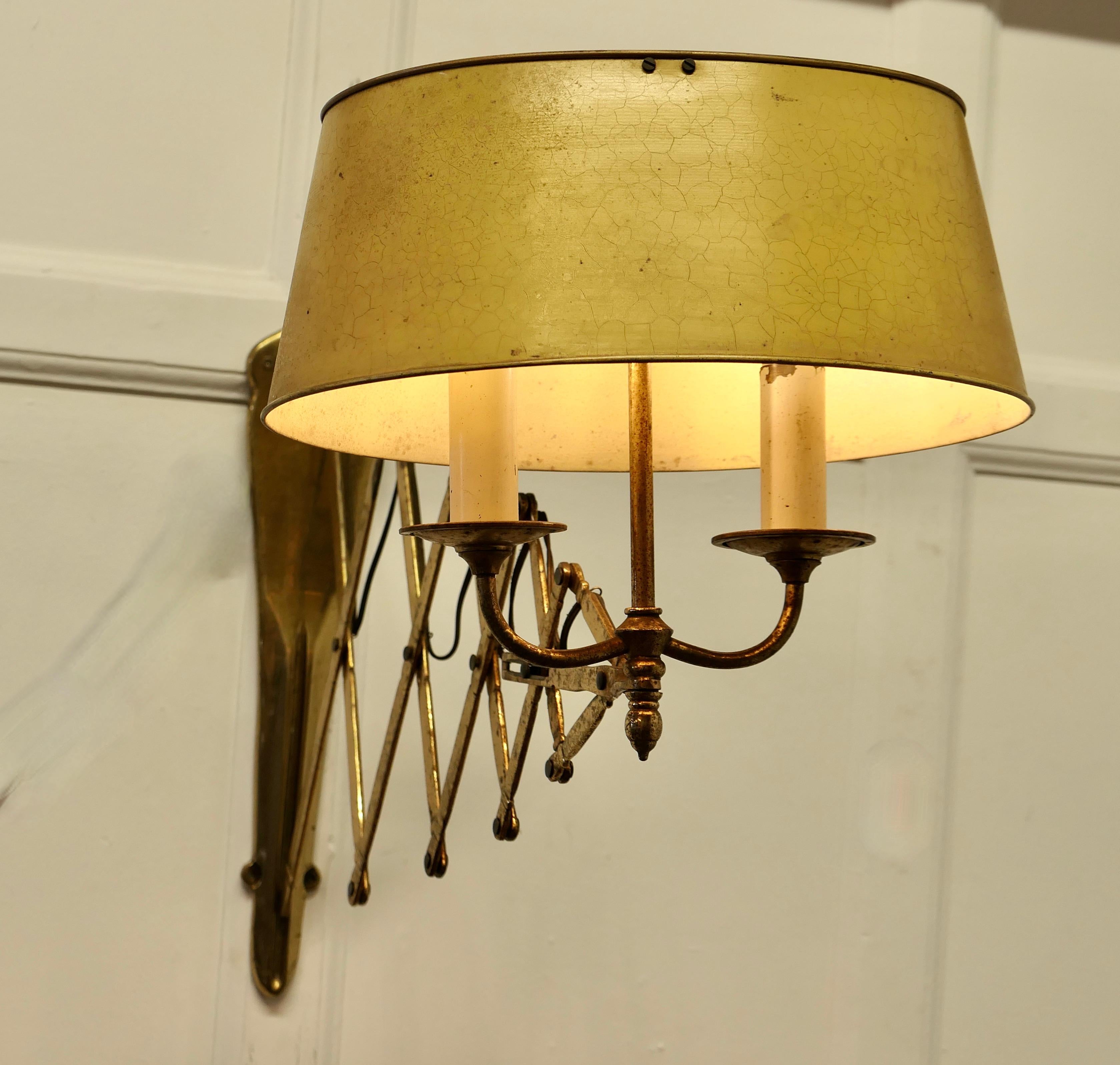 French Painted Toleware and Brass Twin Scissor Lamp
A lovely piece, the brass twin sconce lamp comes with its original adjustable oval toleware shade, this is in cream with crackle finish paint
The lamp fixed to the wall by a brass scissor bracket,