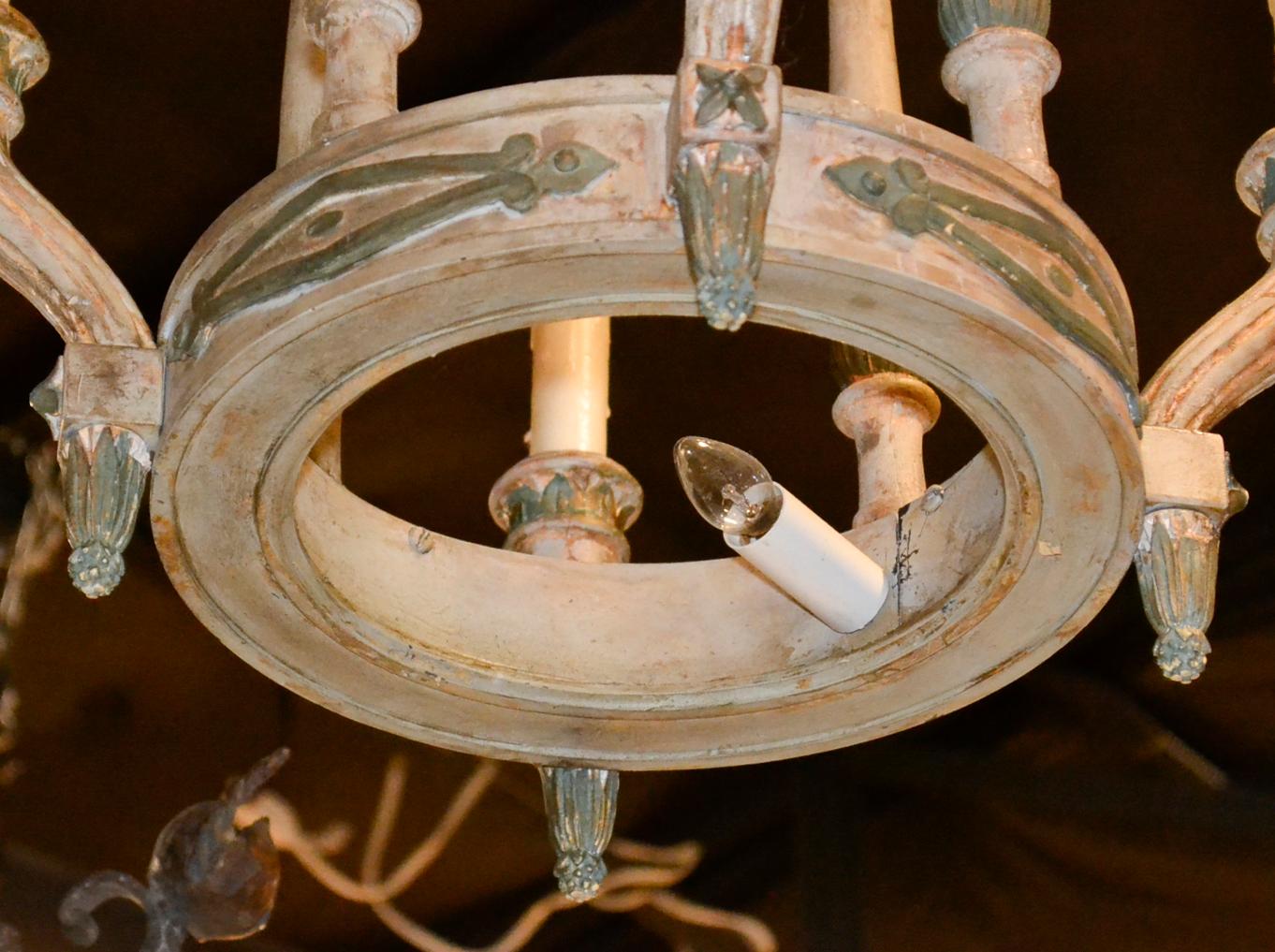 Charming antique French carved and painted wood 4-light chandelier.