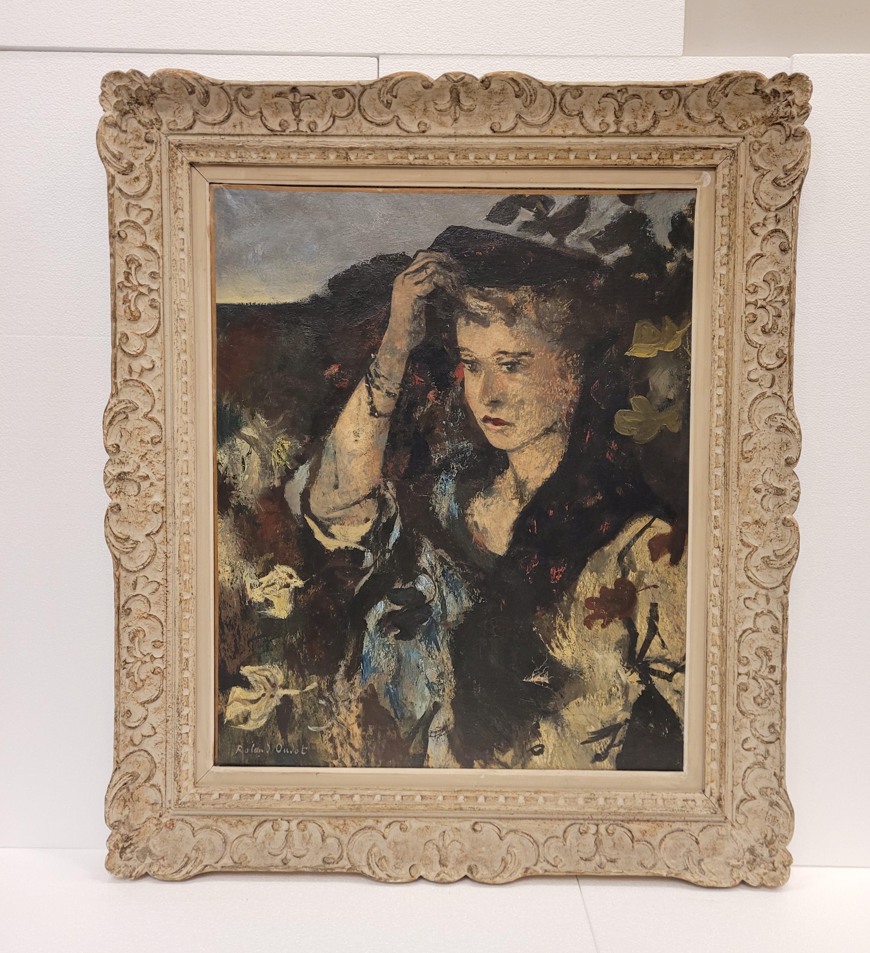 Exquisite female portrait by the French painter Roland Oudot (1897-1981), made in oil on canvas and framed in a delicious white frame. In the foreground of the painting is an elegantly dressed woman holding her hat. In the background, a simple
