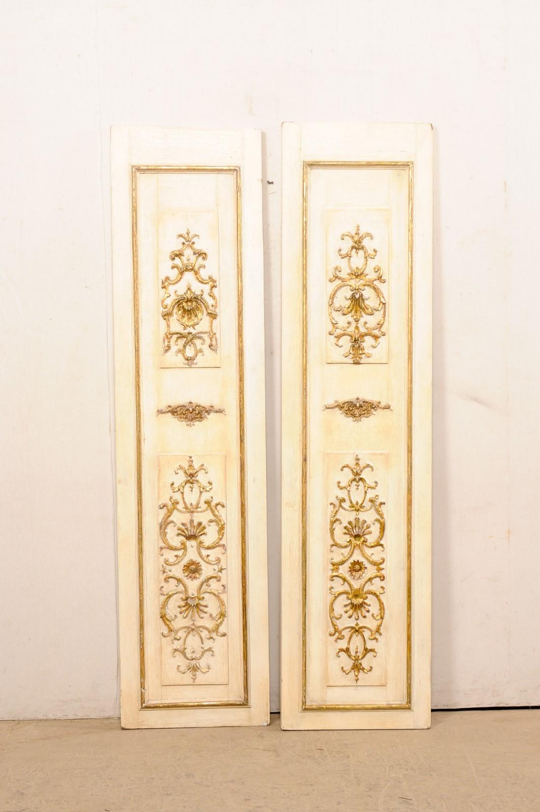 French pair of decorative wall panels with gilt carved accents. This pair of wall ornaments from France are comprised of both vintage and older elements, with a height over over 6.75 feet in height. Each piece has a two- panel front that feature