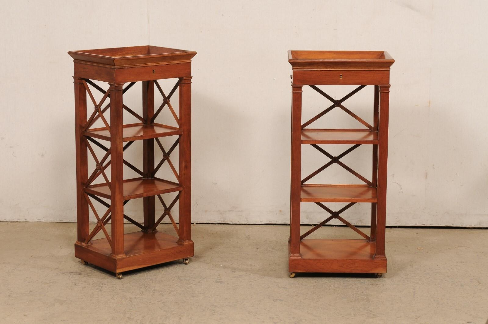A French pair of wooden open-shelved side chests with upper drawer, from the mid 20th century. This mid-century pair of end tables from France each features a tray-style top with slender drawer set beneath, and case which houses three shelves set