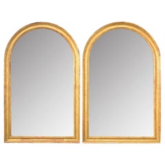 Pareja francesa de espejos dorados arqueados del siglo XIX