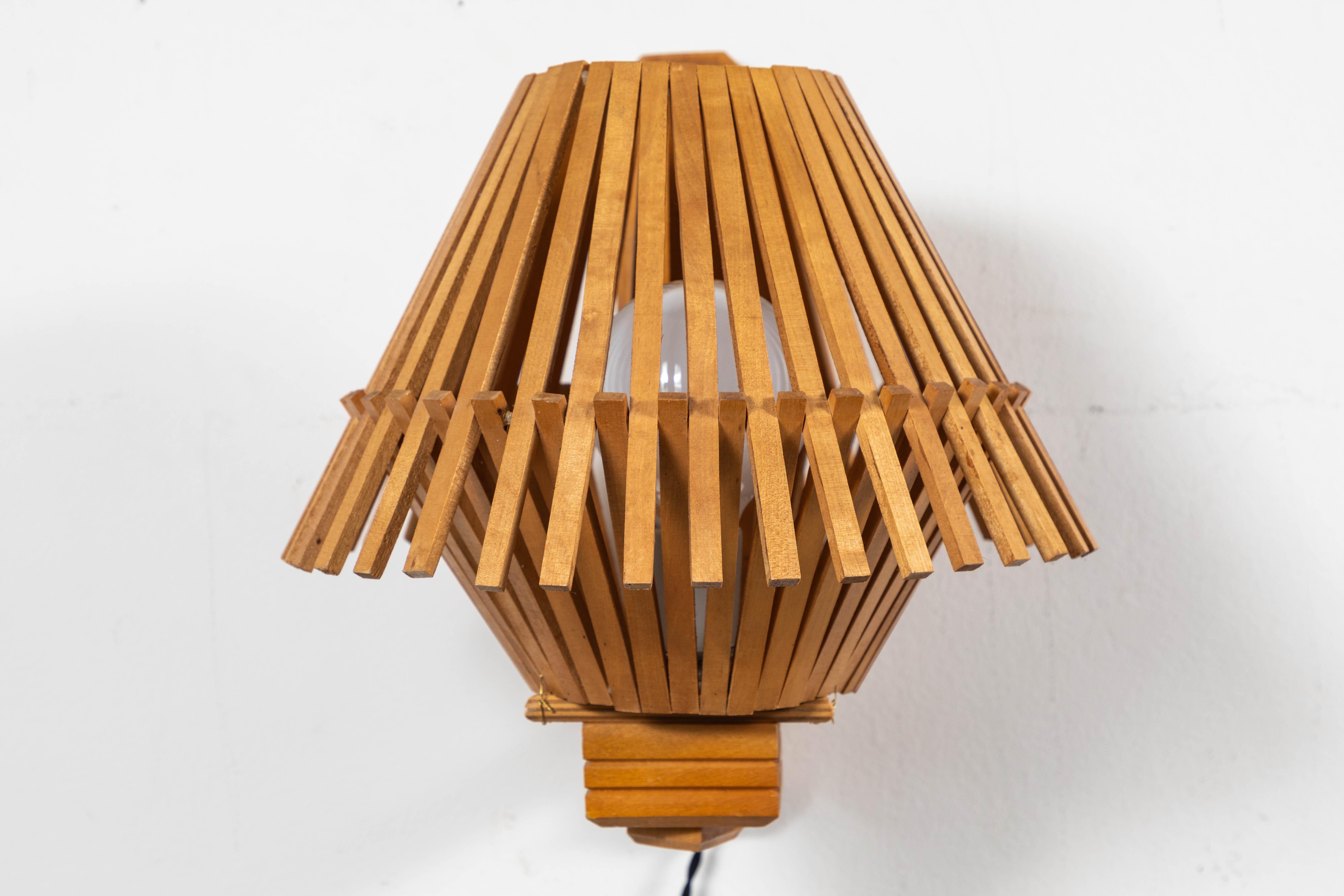 French pair of Geometric angled wood slatted sconces. Plug in with twist switch.