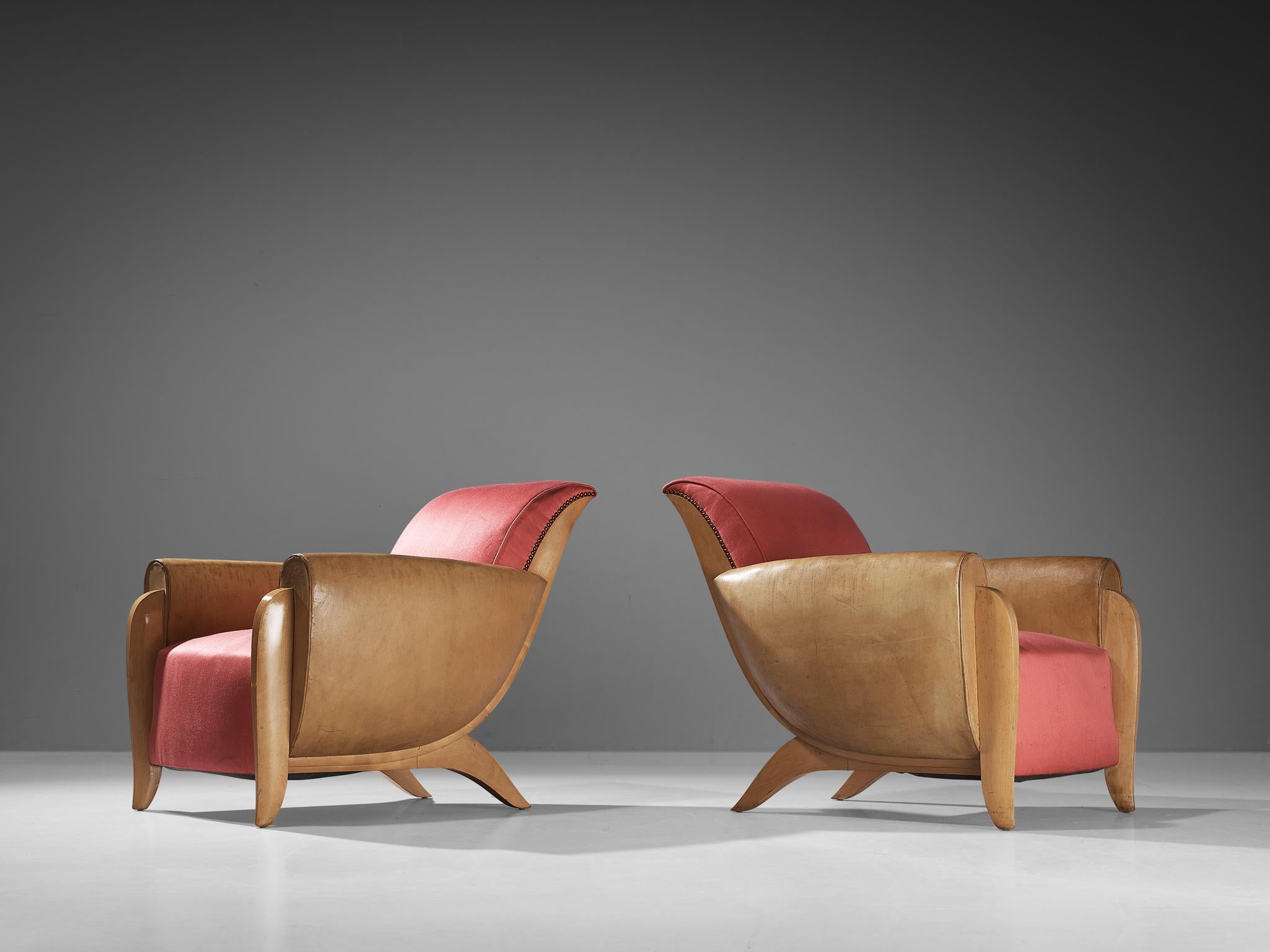 Pair of armchairs, silk, leather, brass, birch, France, Circa. 1930.

These beautifully designed lounge chairs are created in one of the most influential periods for the arts namely the Art Deco Movement. These rare lounge chair originate from
